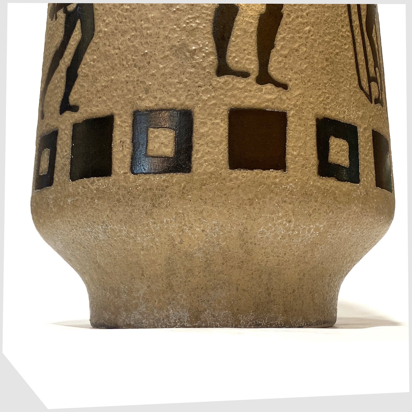 Base foot of the Ceramano 6132/40 Floor Vase designed by Hans Welling featuring a wrap around design of Roman soldiers on a textured beige glaze, shown on a white background