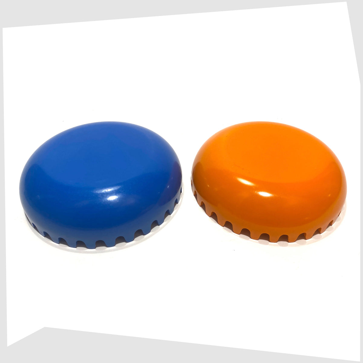 Top of the Clam Ashtray in Orange and Blue, designed by Alan Fletcher for Pentagram design in 1972, shown open on a white background