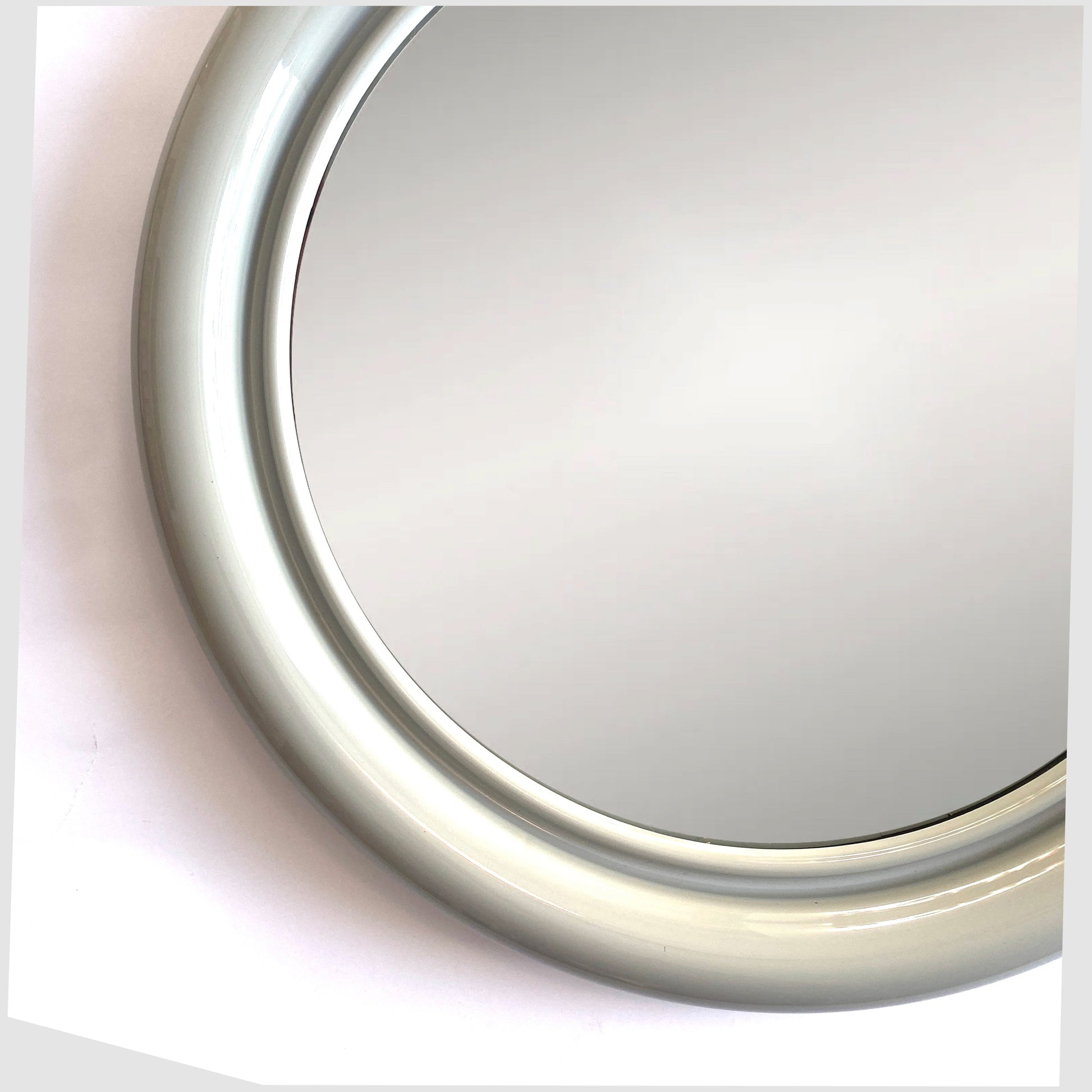 close up of the 1970s Crayonne Circular Wall Mirror in a light grey colour way