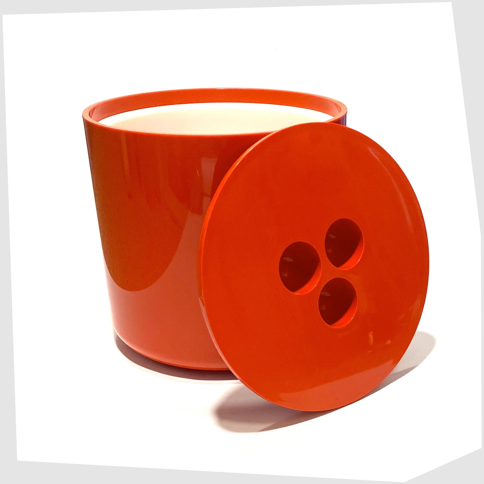 Crayonne Input Ice Bucket in bold red colour way, shown with its lid removed and white inner lining
