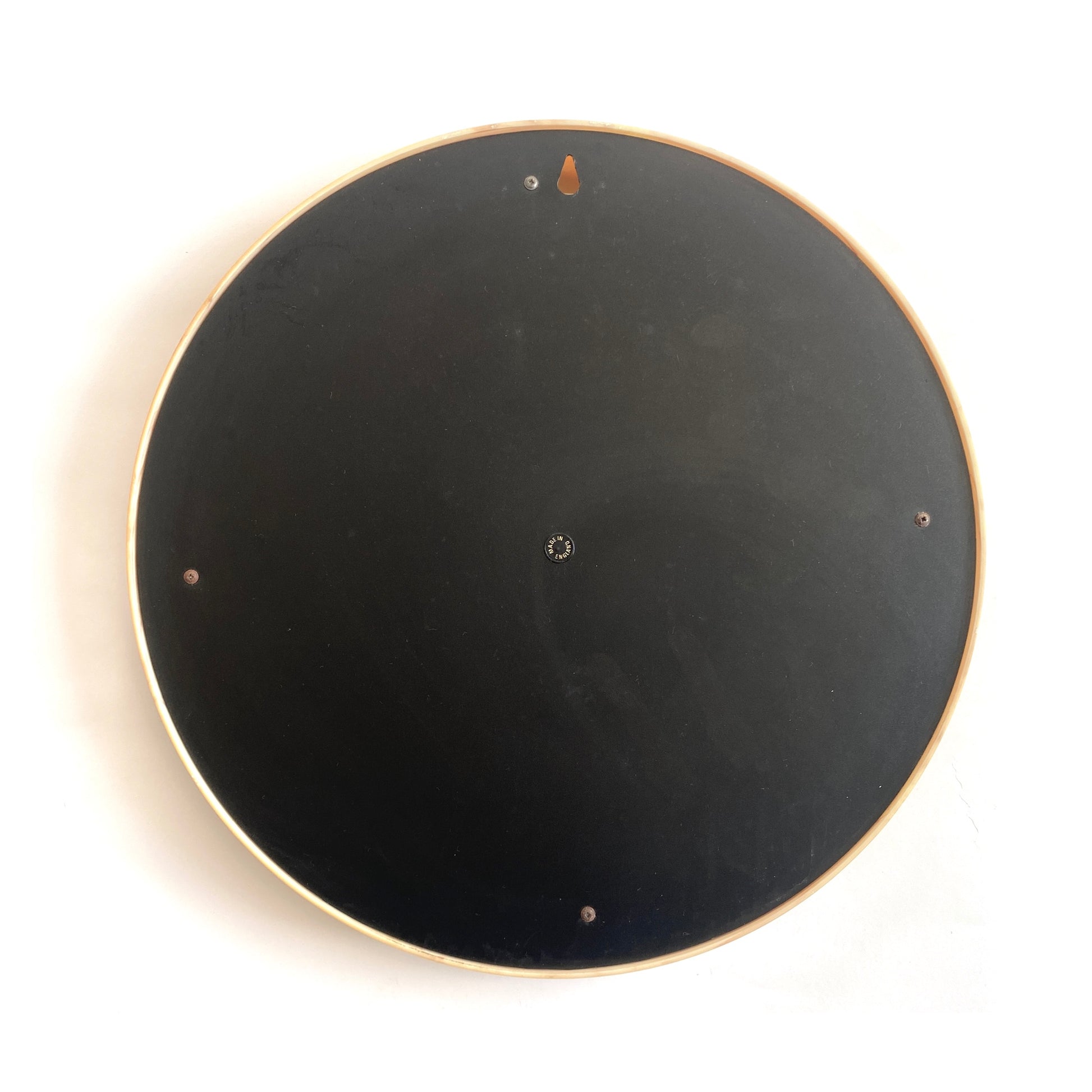 rear of the Crayonne Circular Wall Mirror in a marbled mustard