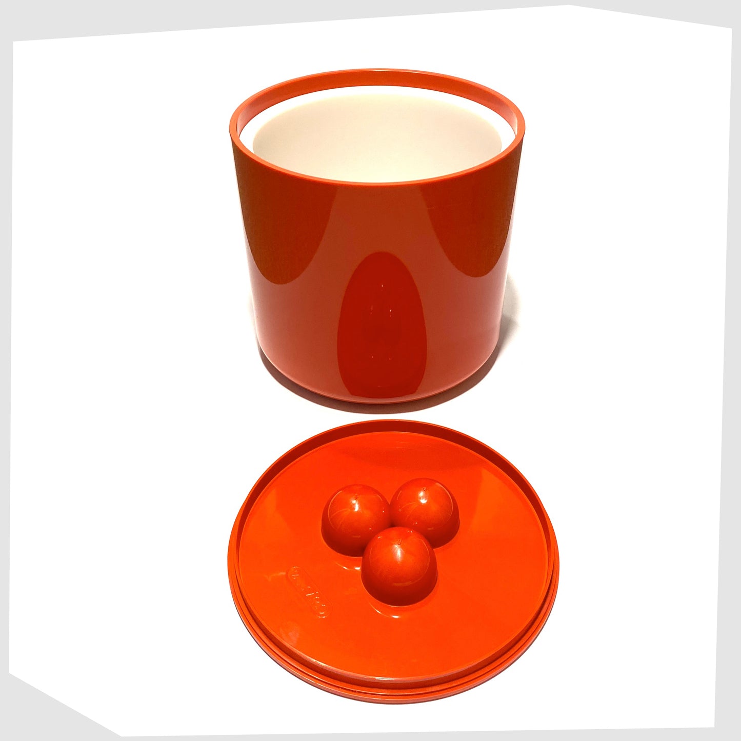 1970s Crayonne Input Ice Bucket in bold red colour way, shown with its lid removed and white inner lining