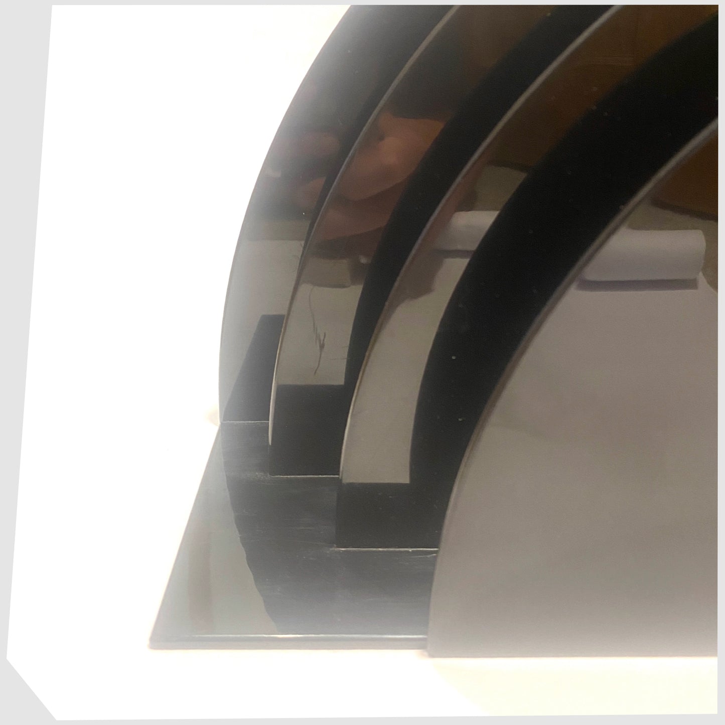 Front close up of the Crayonne Record Rack in Black, designed by Terrance Conran for Habitat's 1970s plastic collection, shown on a white background
