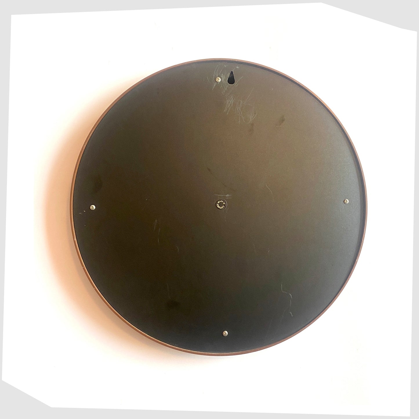 Rear of the 1970s Crayonne Circular Wall Mirror in brown colour way