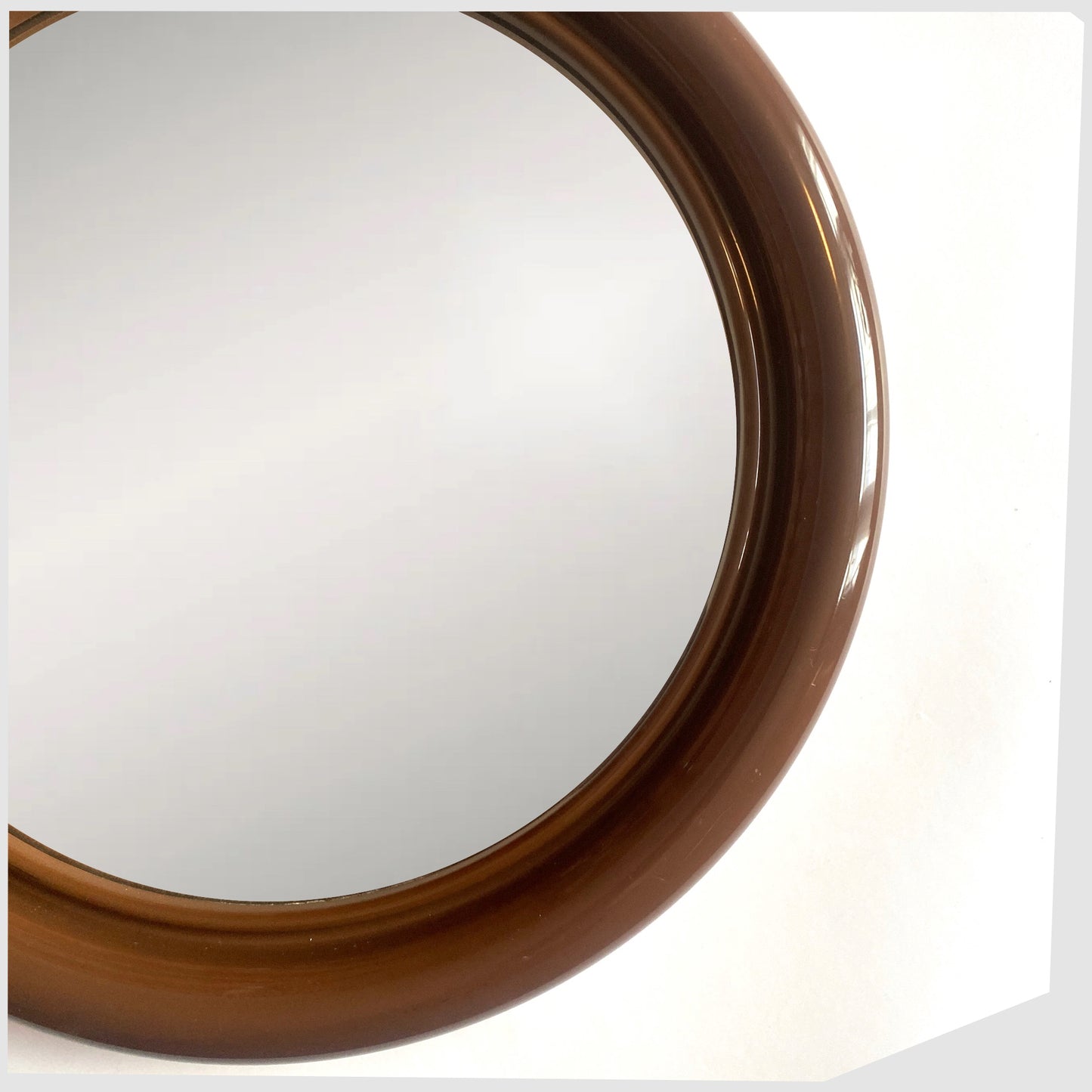 Close up of the 1970s Crayonne Circular Wall Mirror in brown colour way