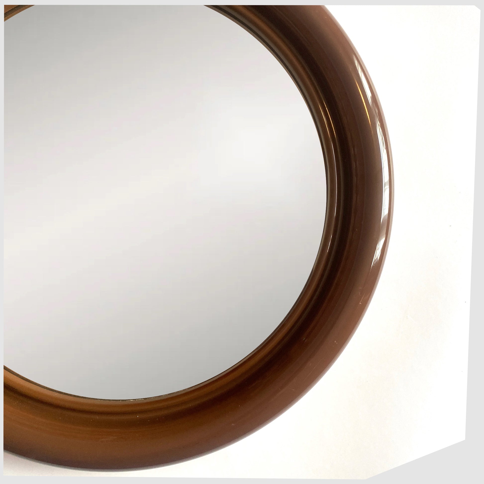 Close up of the 1970s Crayonne Circular Wall Mirror in brown colour way