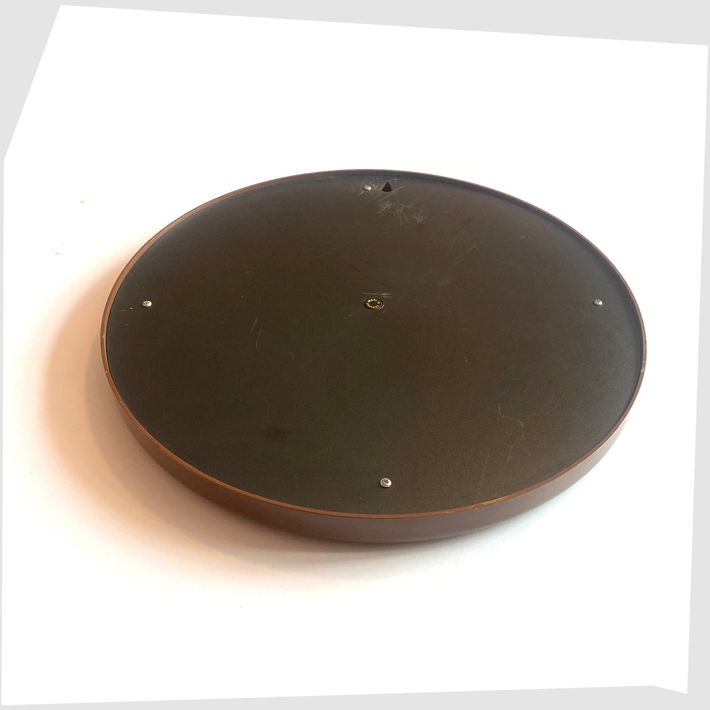 Rear of the 1970s Crayonne Circular Wall Mirror in brown