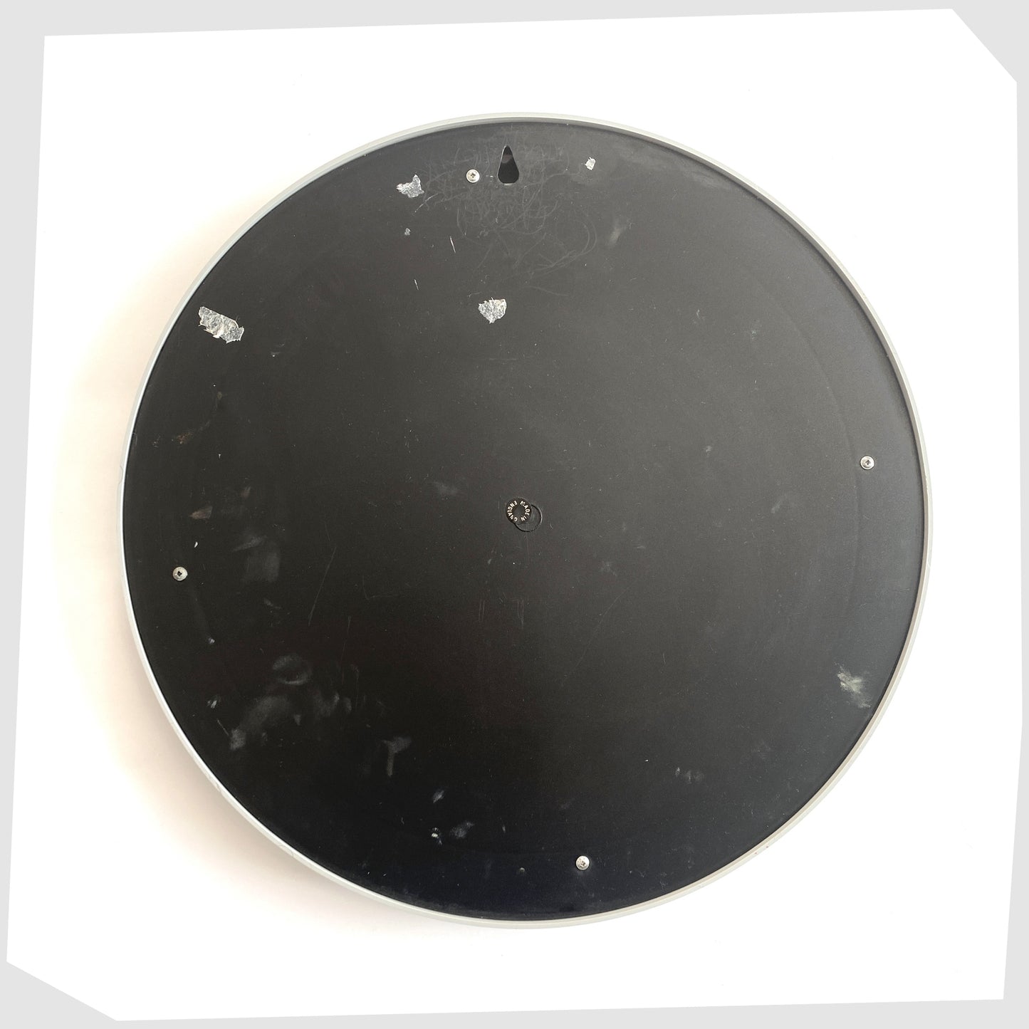 rear of the Crayonne Circular Wall Mirror in a light grey colour way