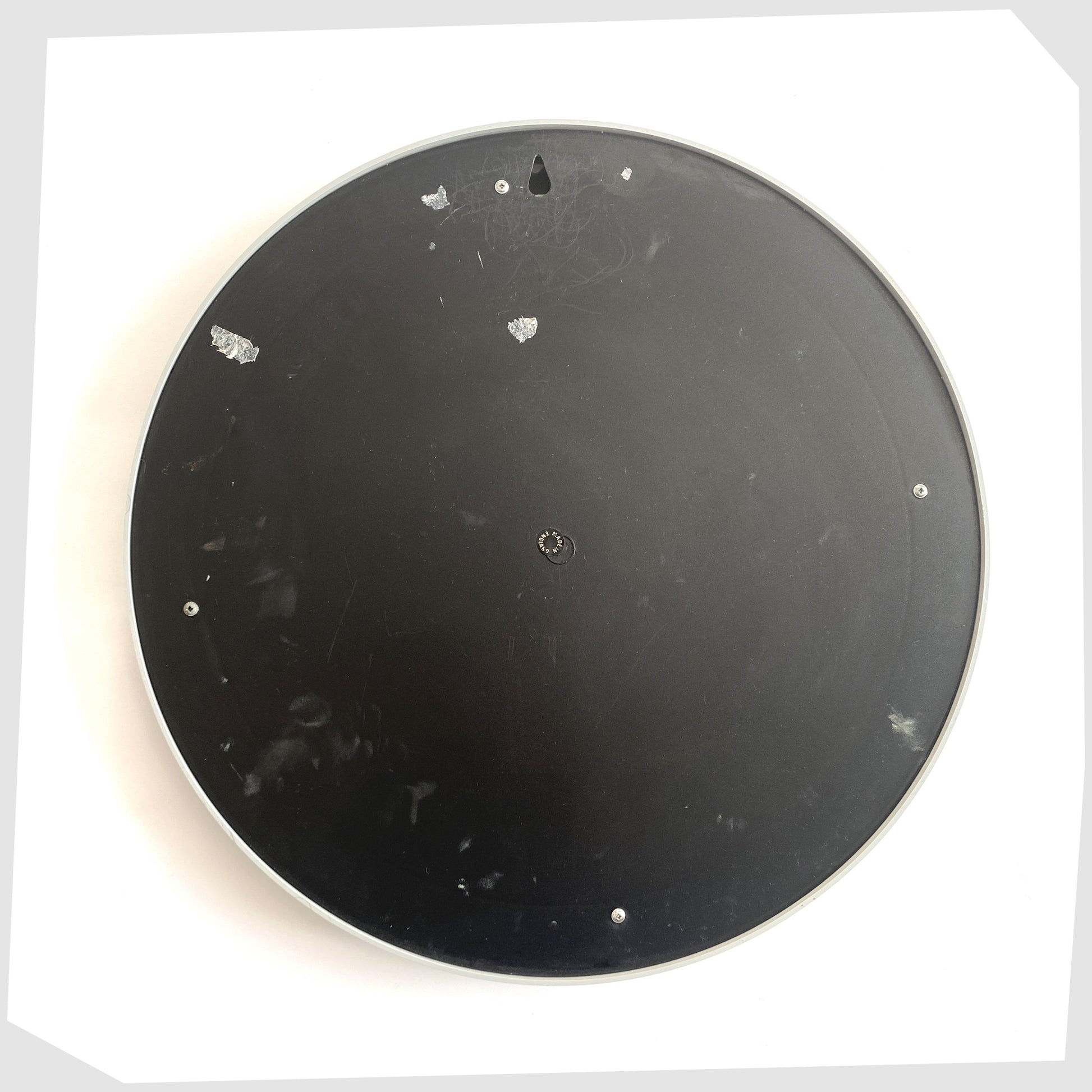 rear of the Crayonne Circular Wall Mirror in a light grey colour way