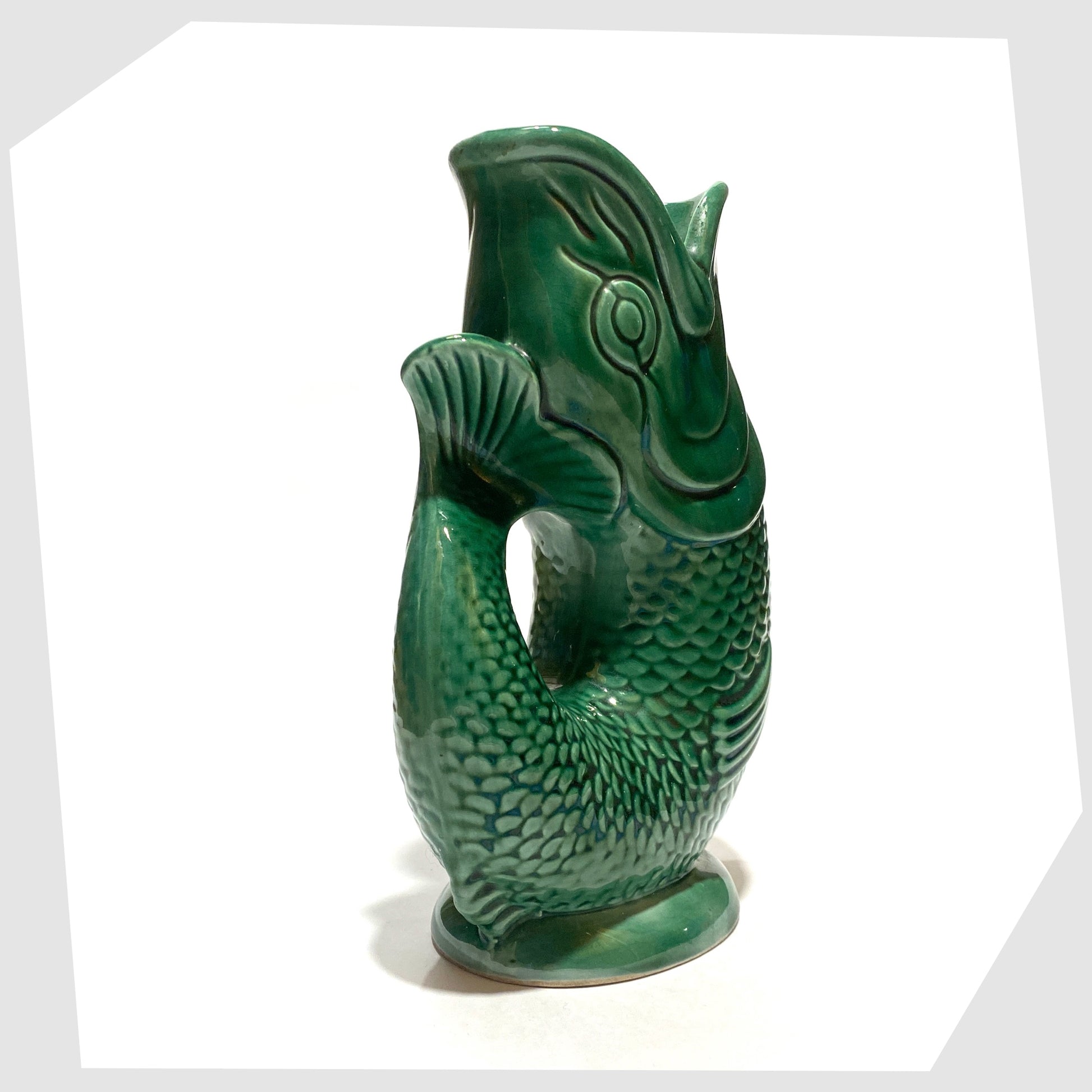 tail of the vintage Dartmouth Pottery Gluggle Jug in the iconic green colour way