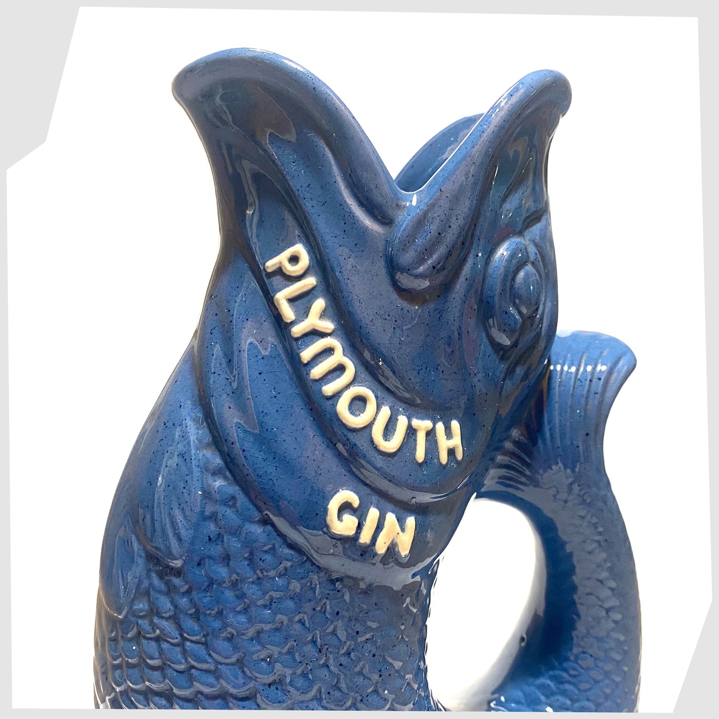 Close up of the Dartmouth Pottery Plymouth Gin Gluggle in a sea blue glaze
