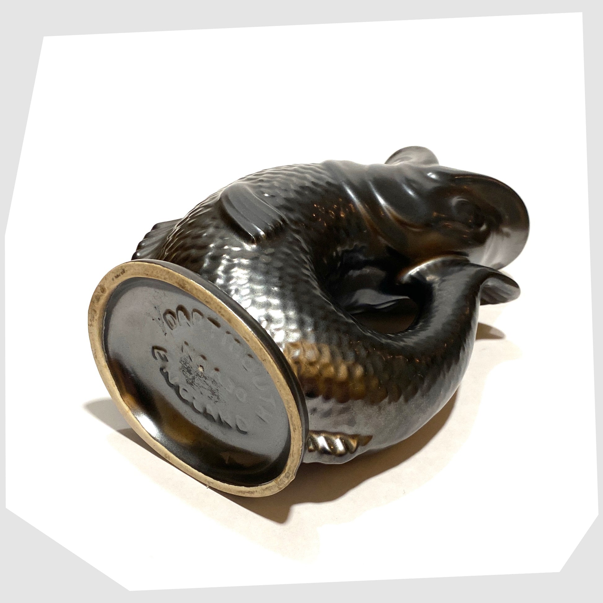 base of the vintage dartmouth pottery gluggle jug in matte black glaze