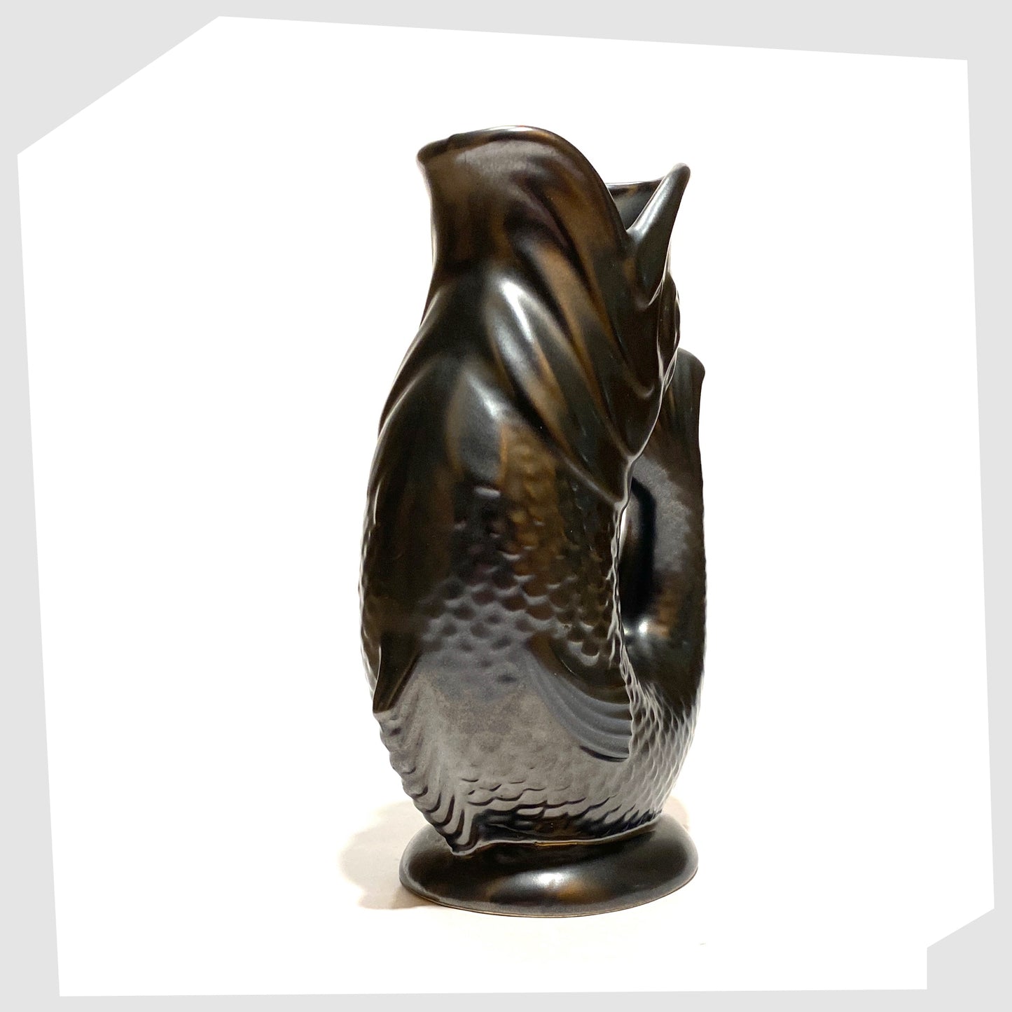 front of the vintage dartmouth pottery gluggle jug in matte black glaze