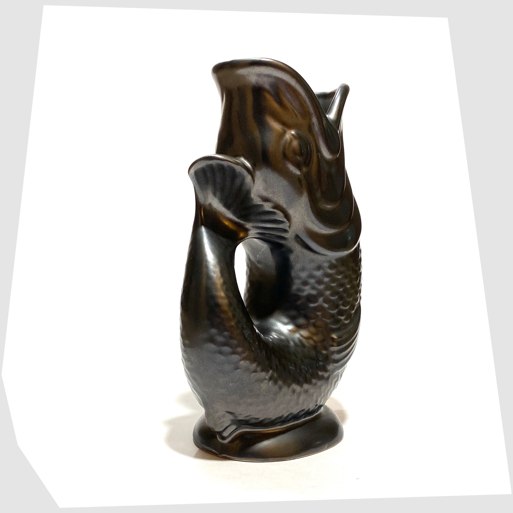 tail of the vintage dartmouth pottery gluggle jug in matte black glaze