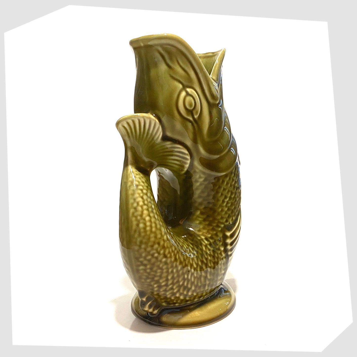 tail of the Dartmouth Pottery Gluggle Jug in khaki green glaze