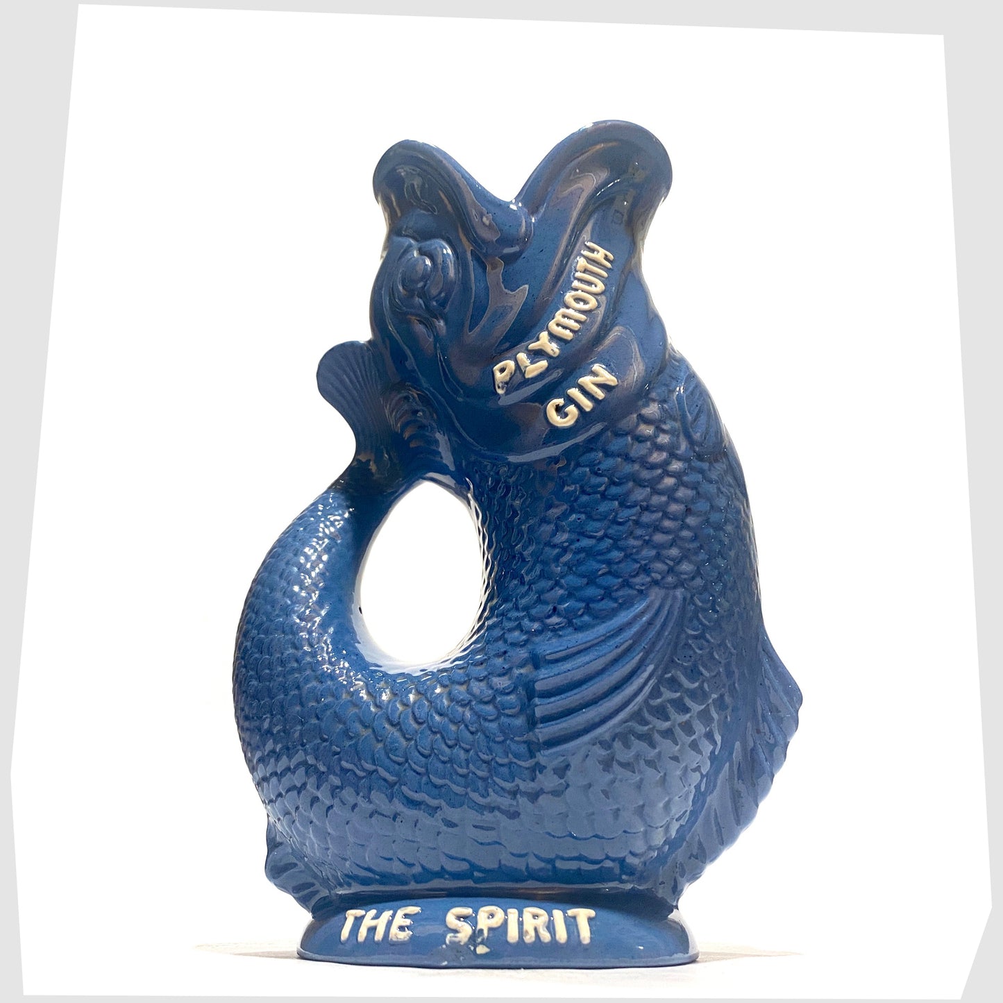 1960s Dartmouth Pottery Plymouth Gin Gluggle in a sea blue glaze with white text around the spout and base