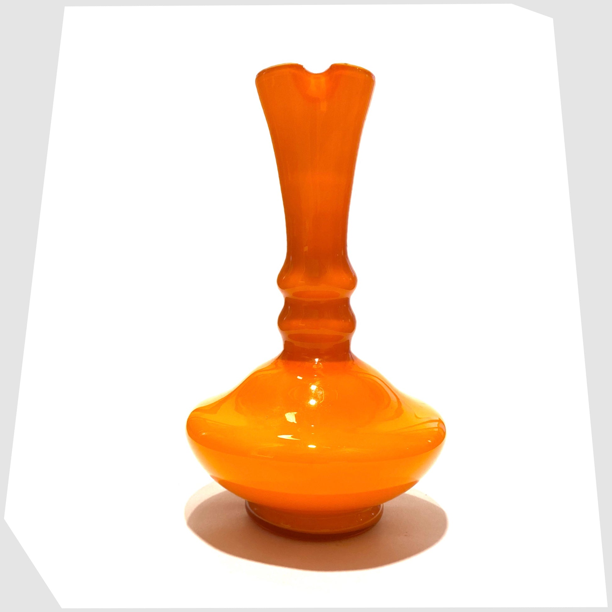 front of the empoli glass jug in vibrant orange cased glass with clear glass handle