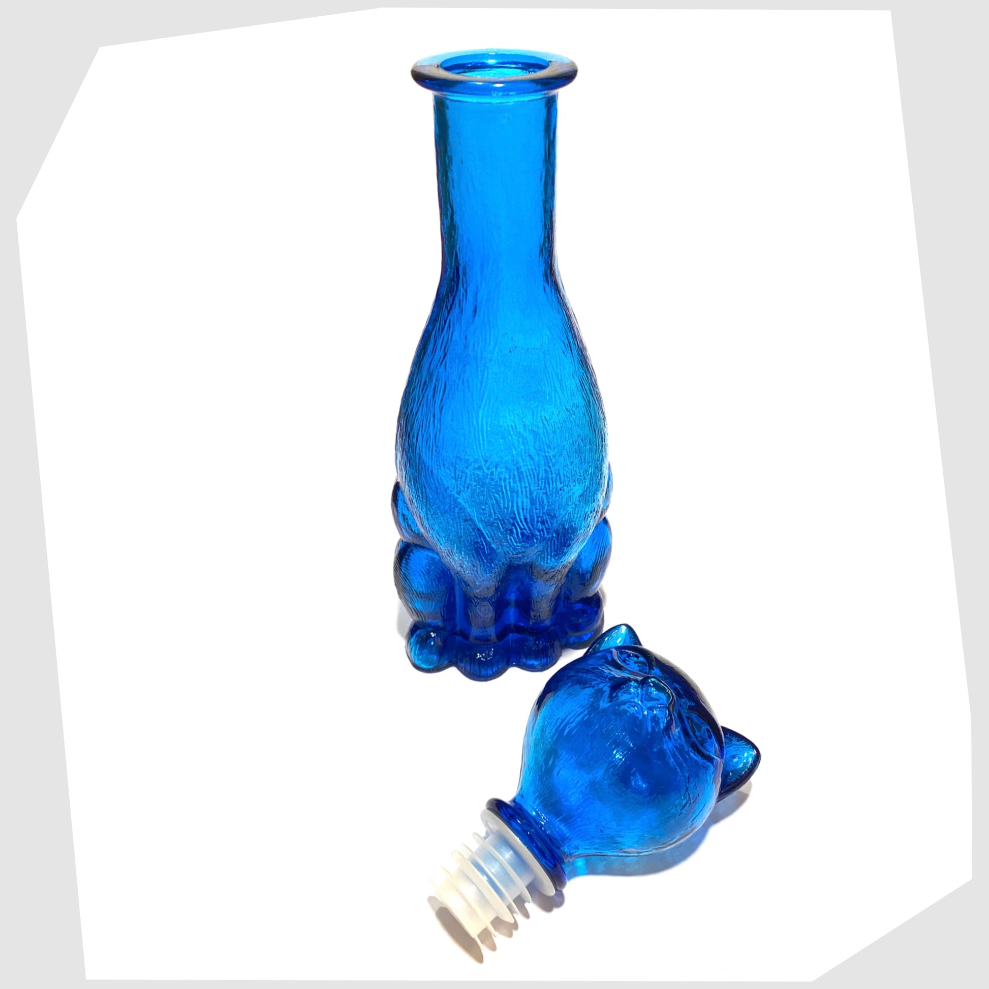 Rear of the Empoli Art Glass Cat-Shaped Decorative Bottle in rich blue glass with the stopper removed