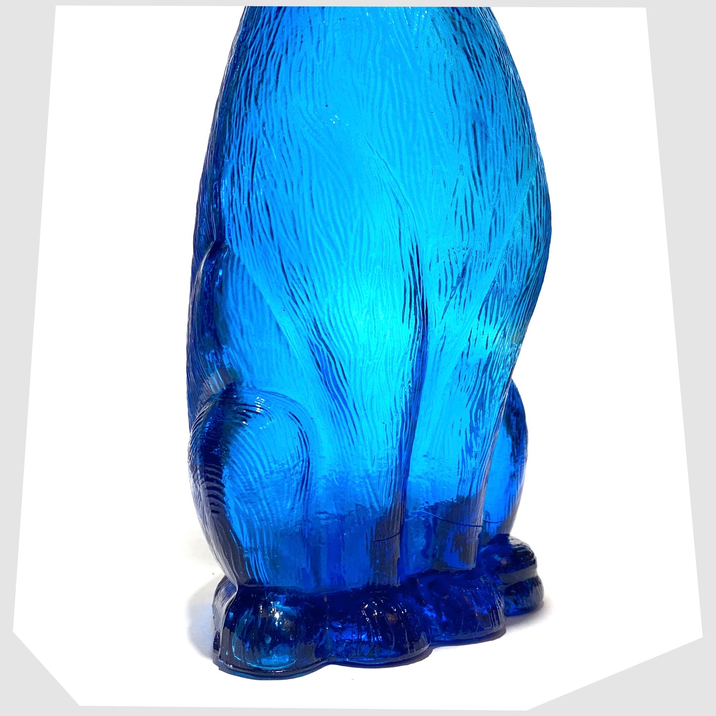 base of the Empoli Art Glass Cat-Shaped Decorative Bottle in rich blue glass
