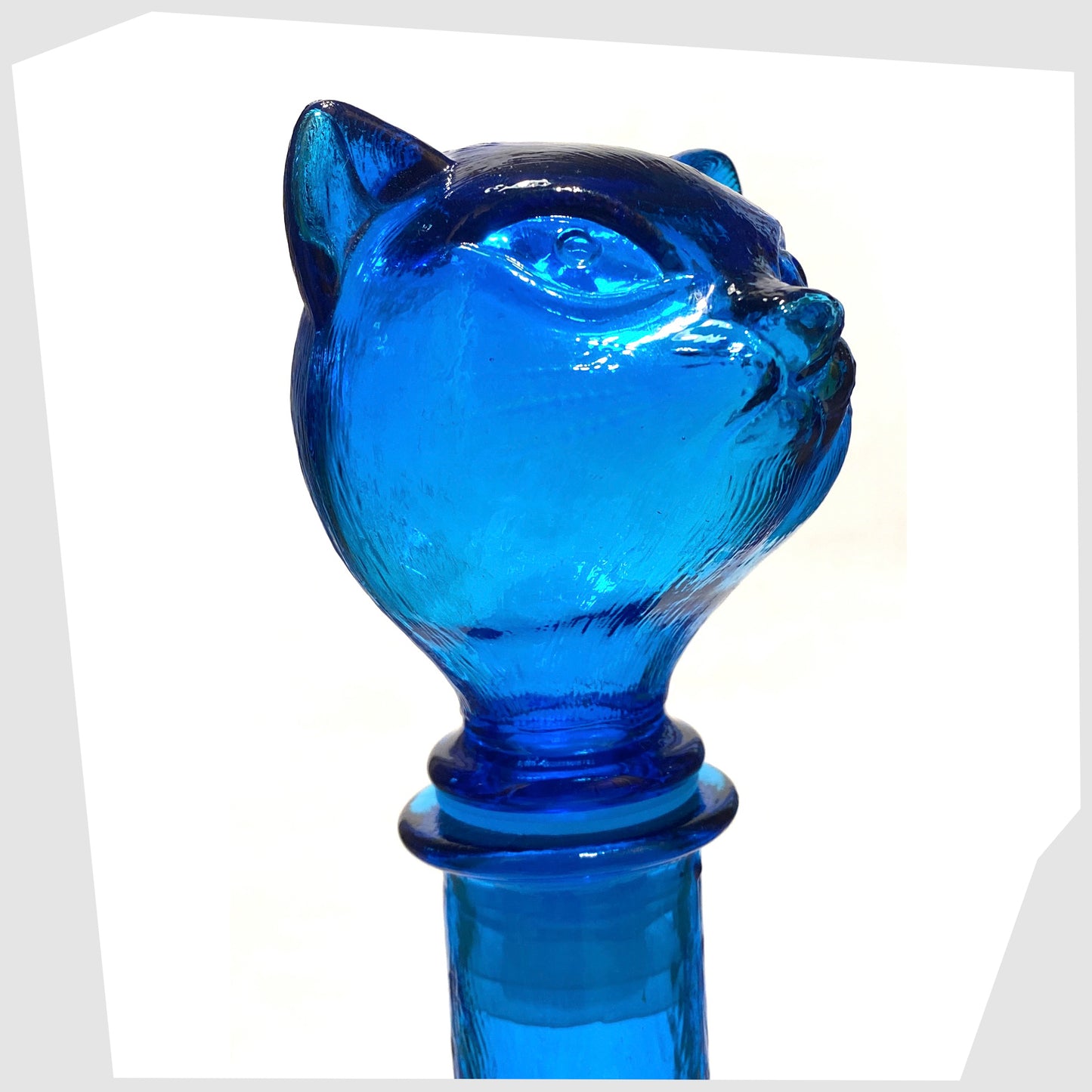 close up of the Empoli Art Glass Cat-Shaped Decorative Bottle in rich blue glass
