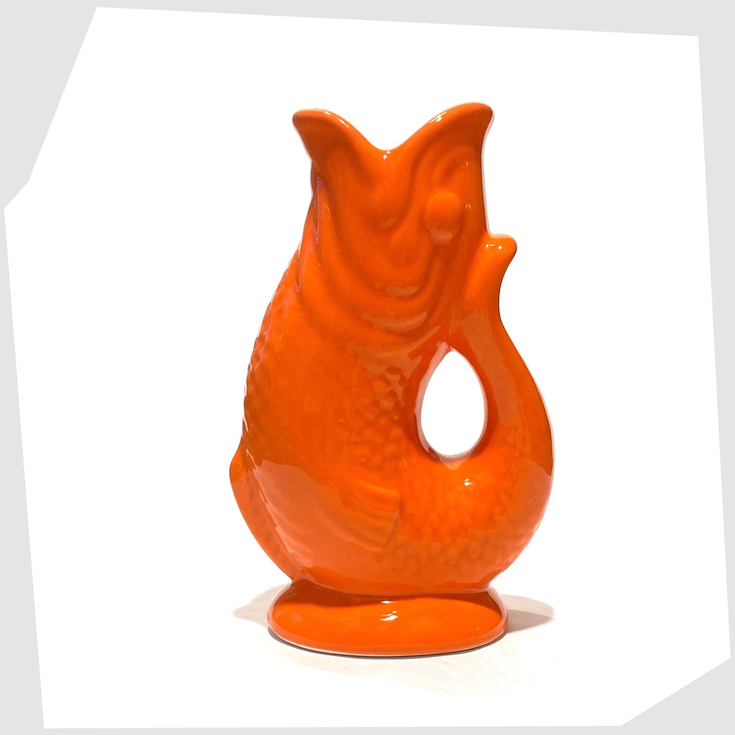 fish-shaped ceramic vase in bold orange glaze 