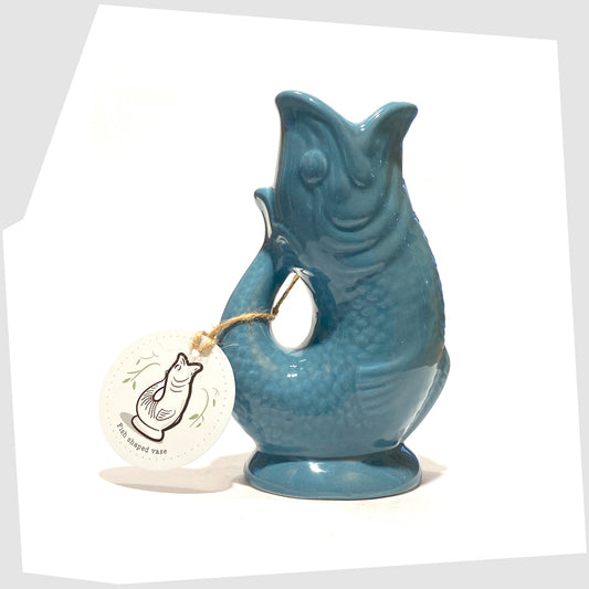 fish-shaped ceramic vase in blue shown with its printed card tag