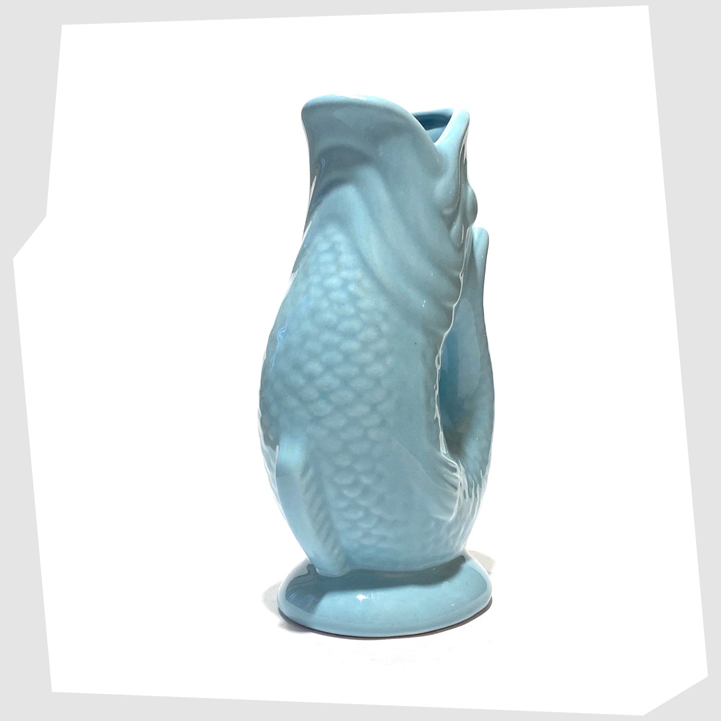 front of the Fish-Shaped Ceramic Vase in Light Blue glaze