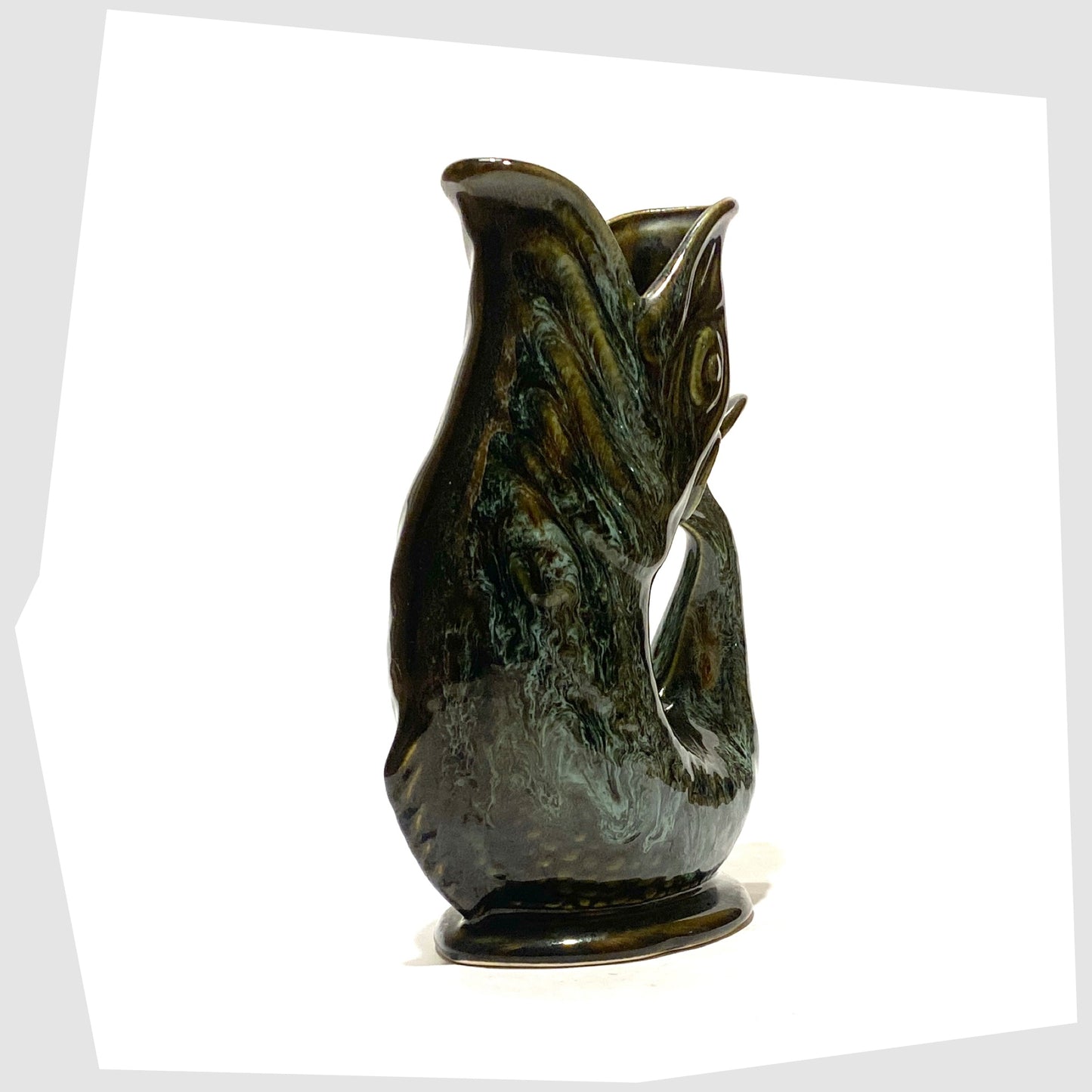 front of the vintage fosters studio pottery gluggle jug in green drip glaze