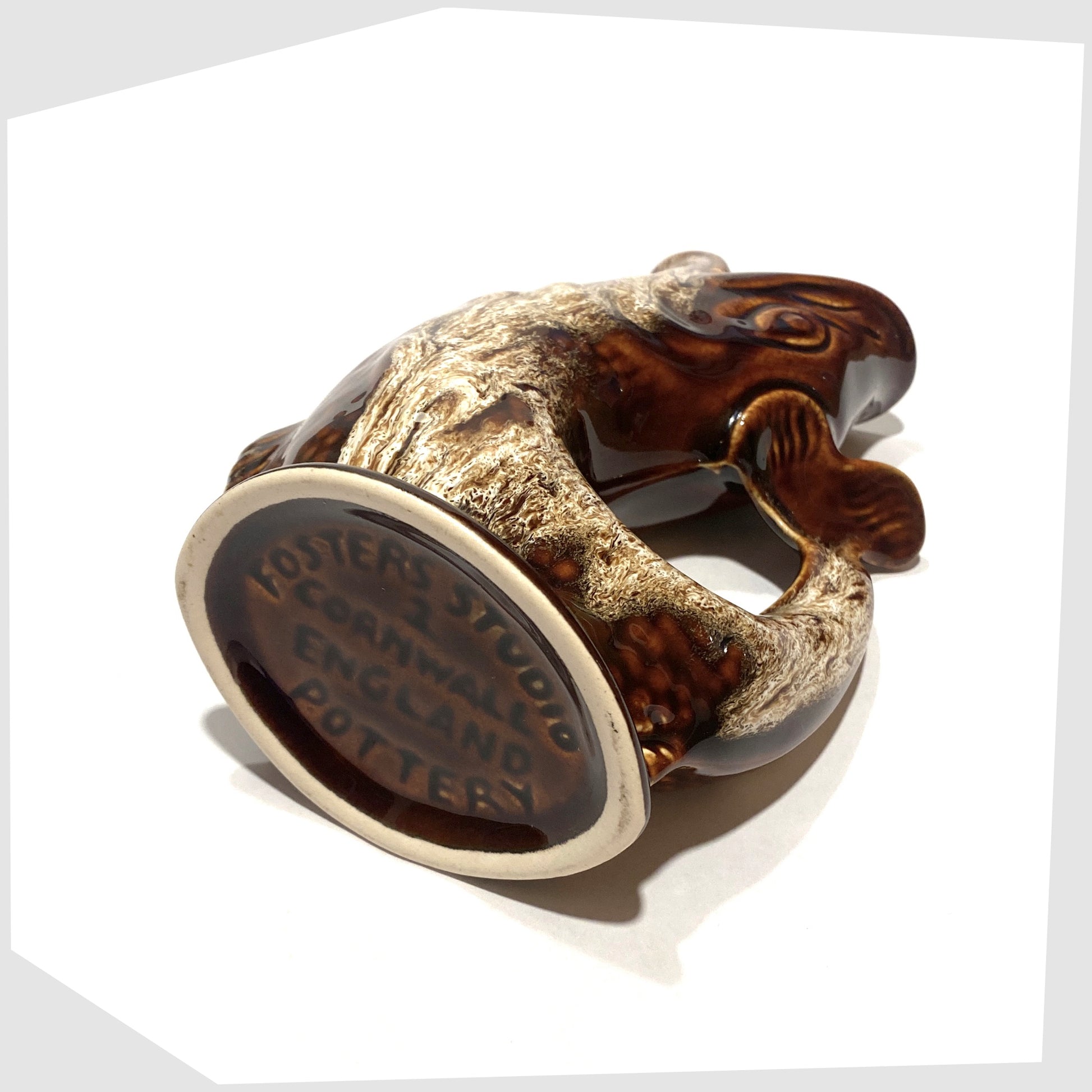 base of the vintage fosters studio pottery fish-shaped gluggle jug in chestnut brown drip glaze