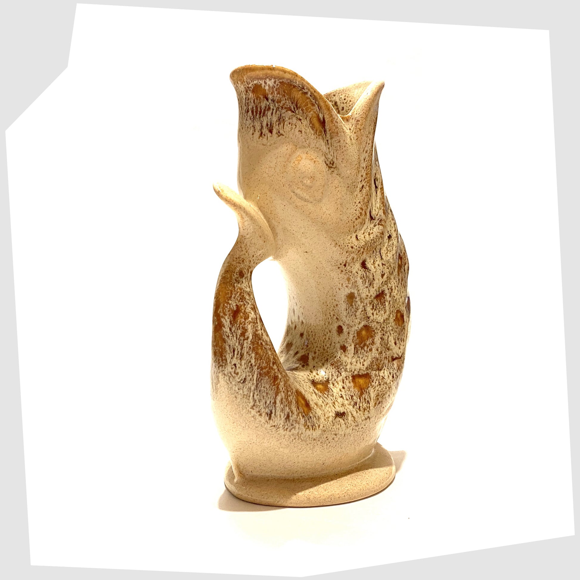 tail of the honeycomb gluggle jug by fosters studio pottery, cornwall