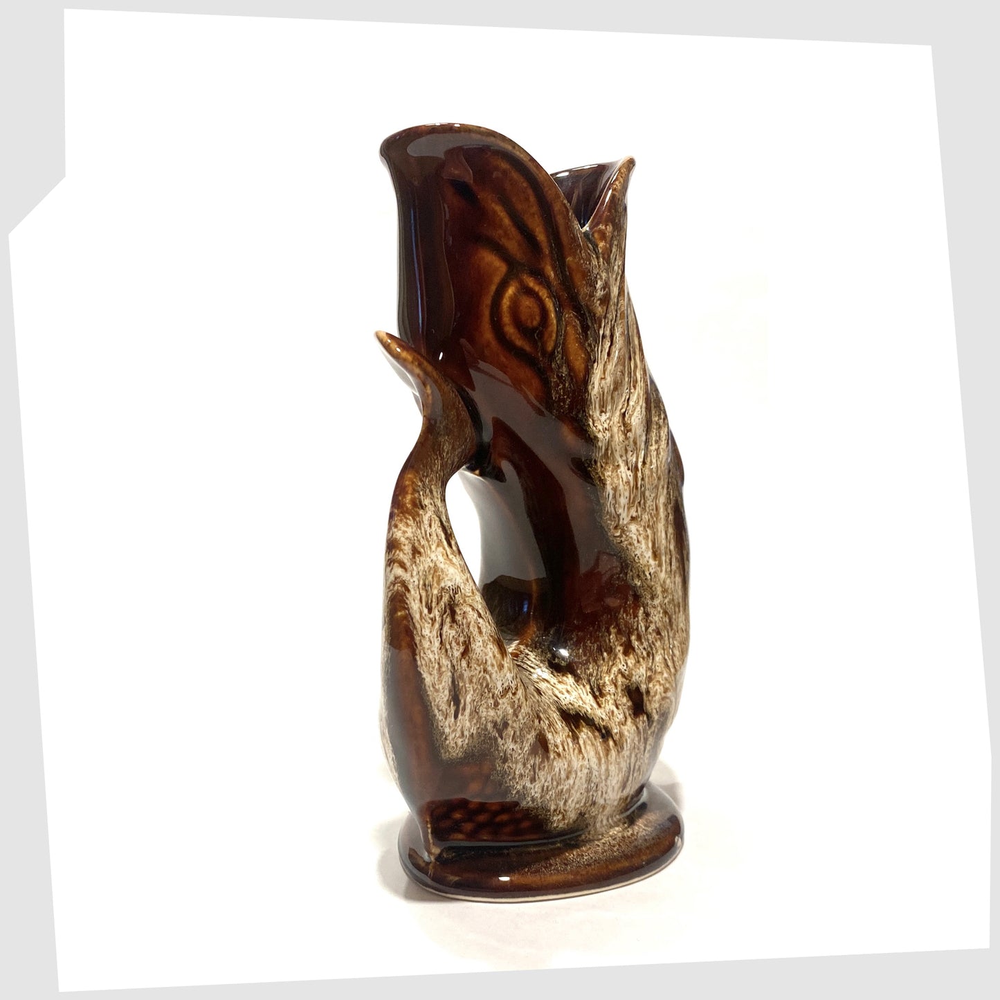 tail of the vintage fosters studio pottery gluggle jug in chestnut brown drip glaze