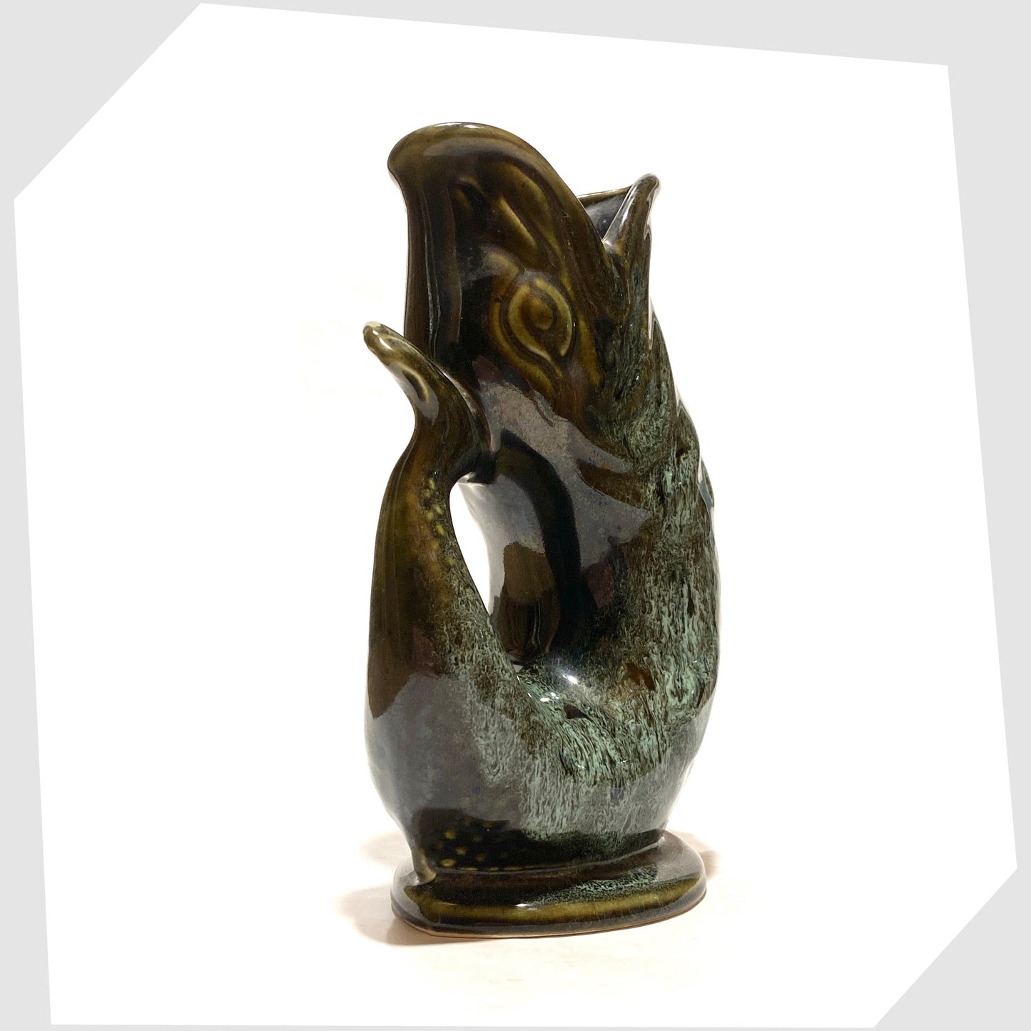tail of the vintage fosters studio pottery gluggle jug in green drip glaze