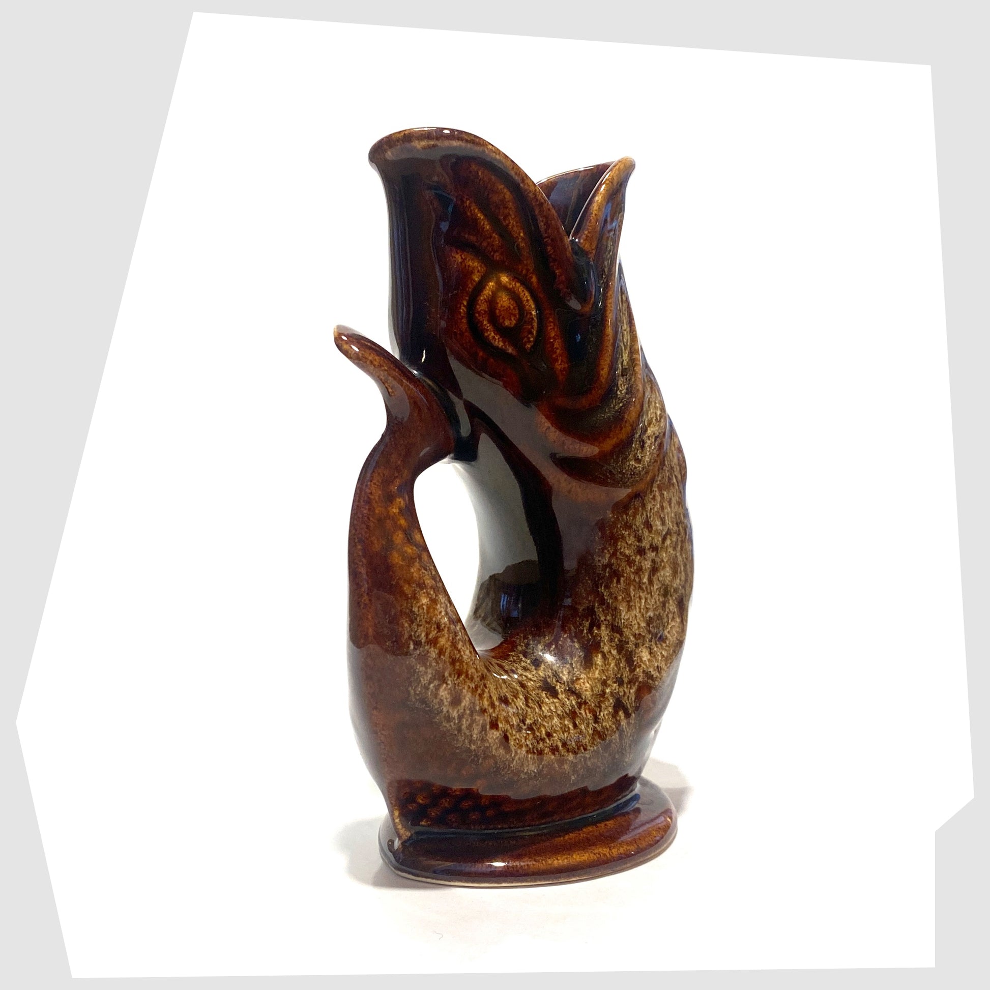 tail of the vintage fosters studio pottery gluggle jug in chestnut brown drip glaze