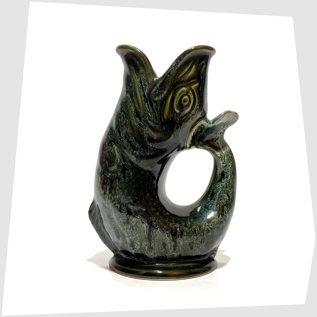 Vintage 1960s Fosters Studio Pottery Gluggle Jug in green drip glaze, shown on a white background