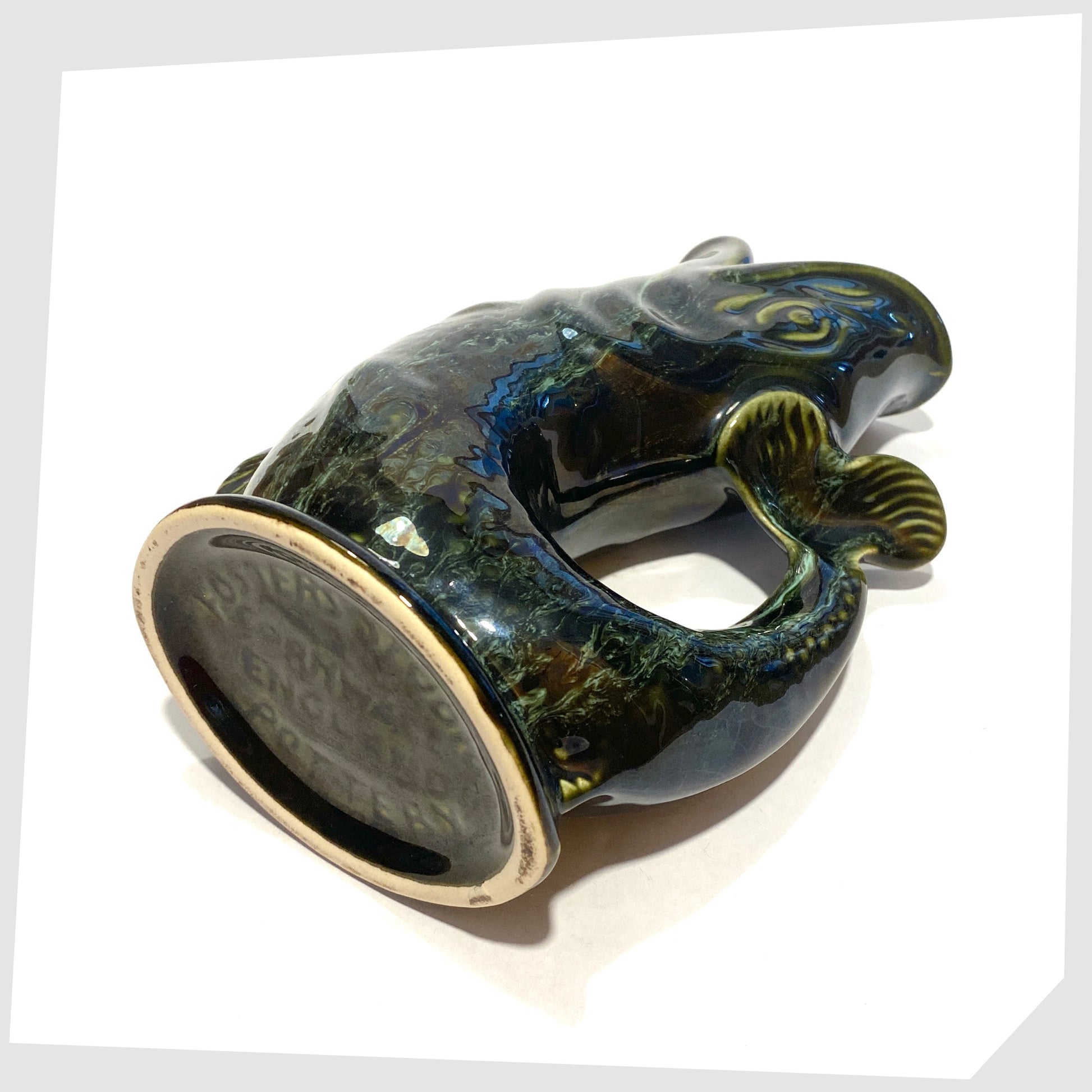 base of the vintage fosters studio pottery gluggle jug in green drip glaze