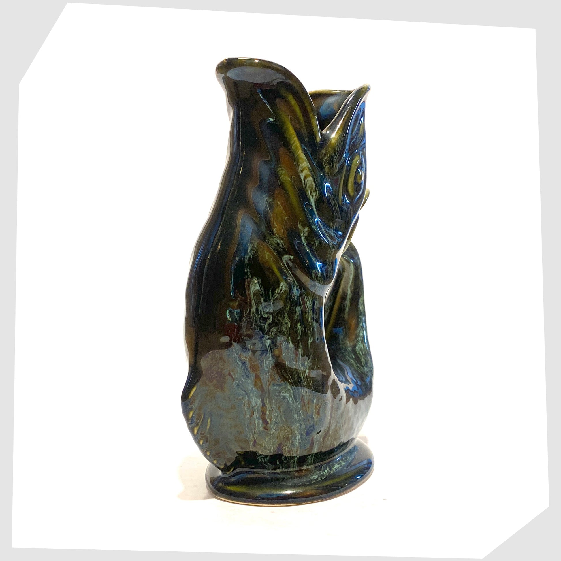 front of the vintage fosters studio pottery gluggle jug in green drip glaze