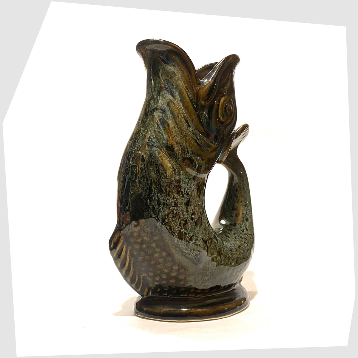 Front of the Fosters Studio Pottery Gluggle in Green honeycomb drip glaze, shown on a white background