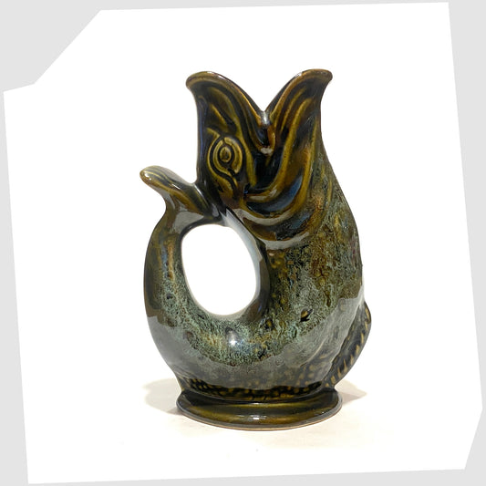 Fish-shaped Fosters Studio Pottery Gluggle Jug in green drip glaze, shown on a white background