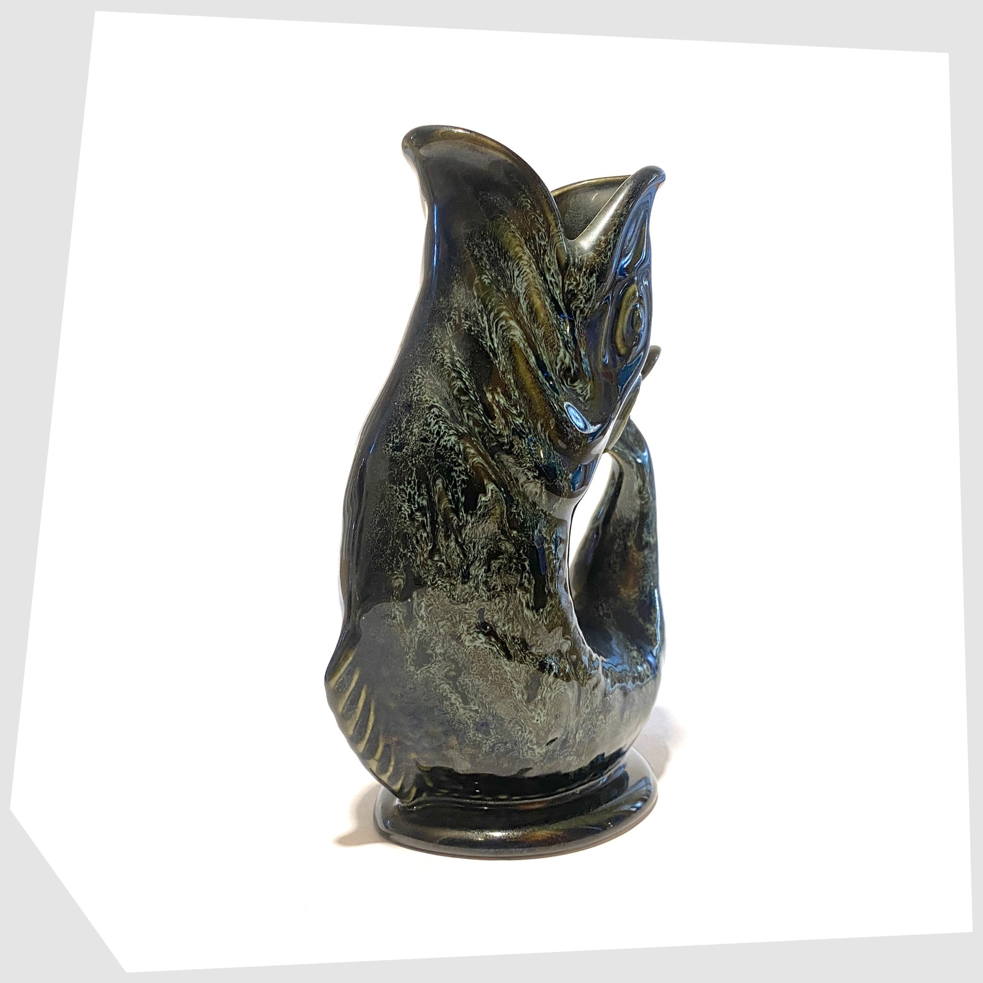 front of the fosters studio pottery gluggle jug in green honeycomb glaze