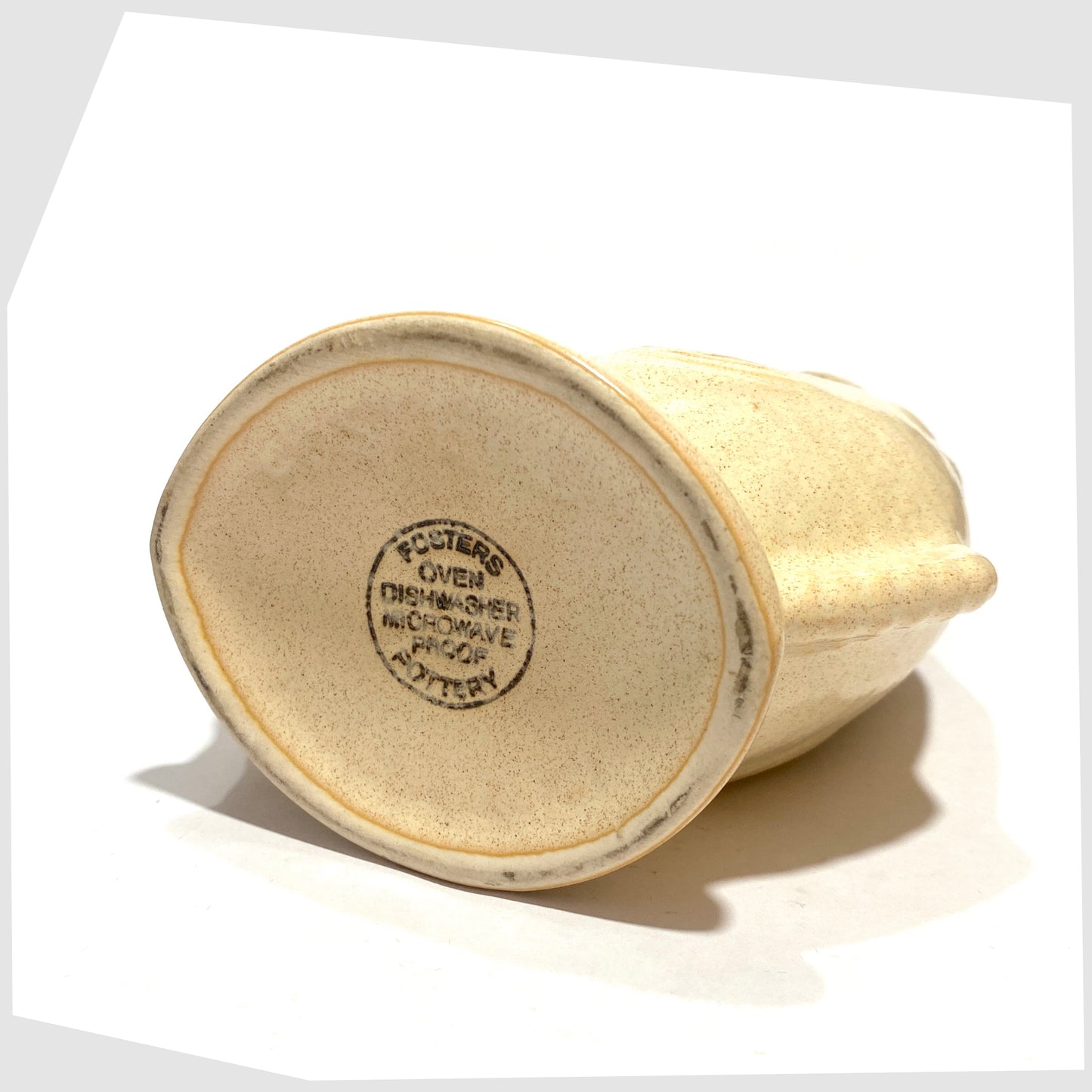 Underside of the Fosters Studio Pottery Gluggle Jug in Honeycomb drip glaze, shown on a white background