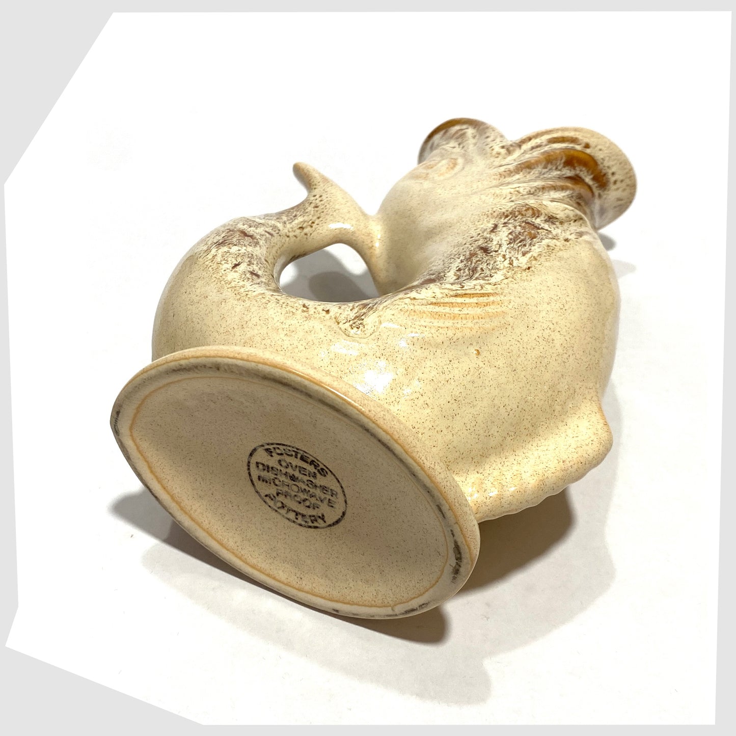 Base view of the Fosters Studio Pottery Gluggle Jug in Honeycomb drip glaze, shown on a white background