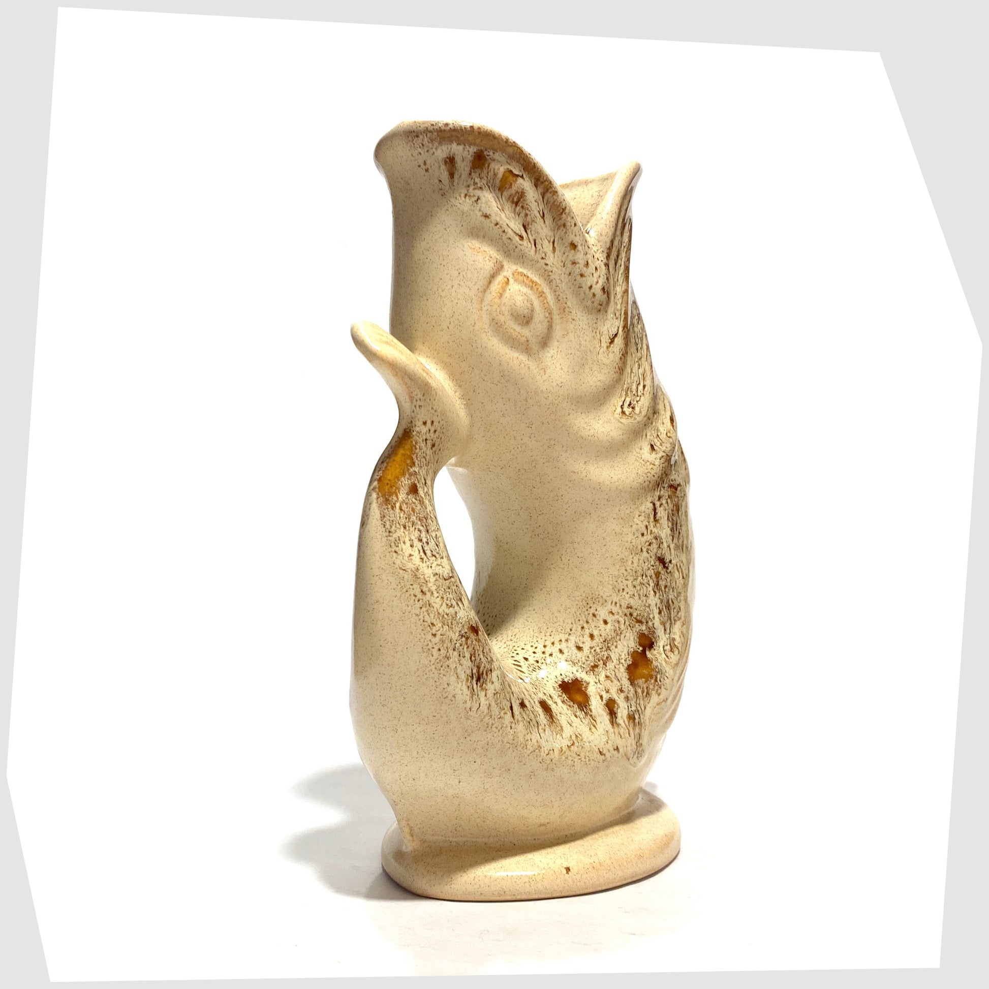 Tail/Handle of the Fosters Studio Pottery Gluggle Jug in Honeycomb drip glaze, shown on a white background