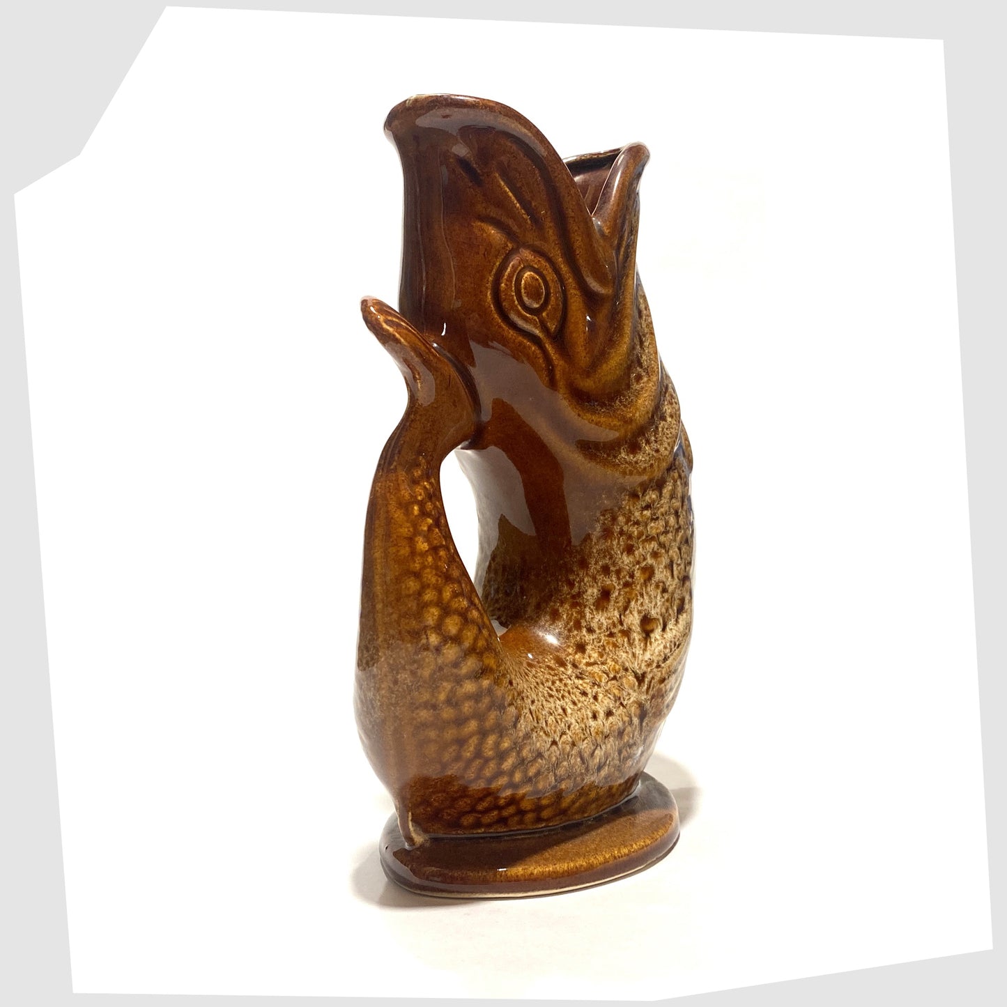 tail/handle of the Fosters Studio Pottery Gluggle Jug in brown and amber honeycomb glaze