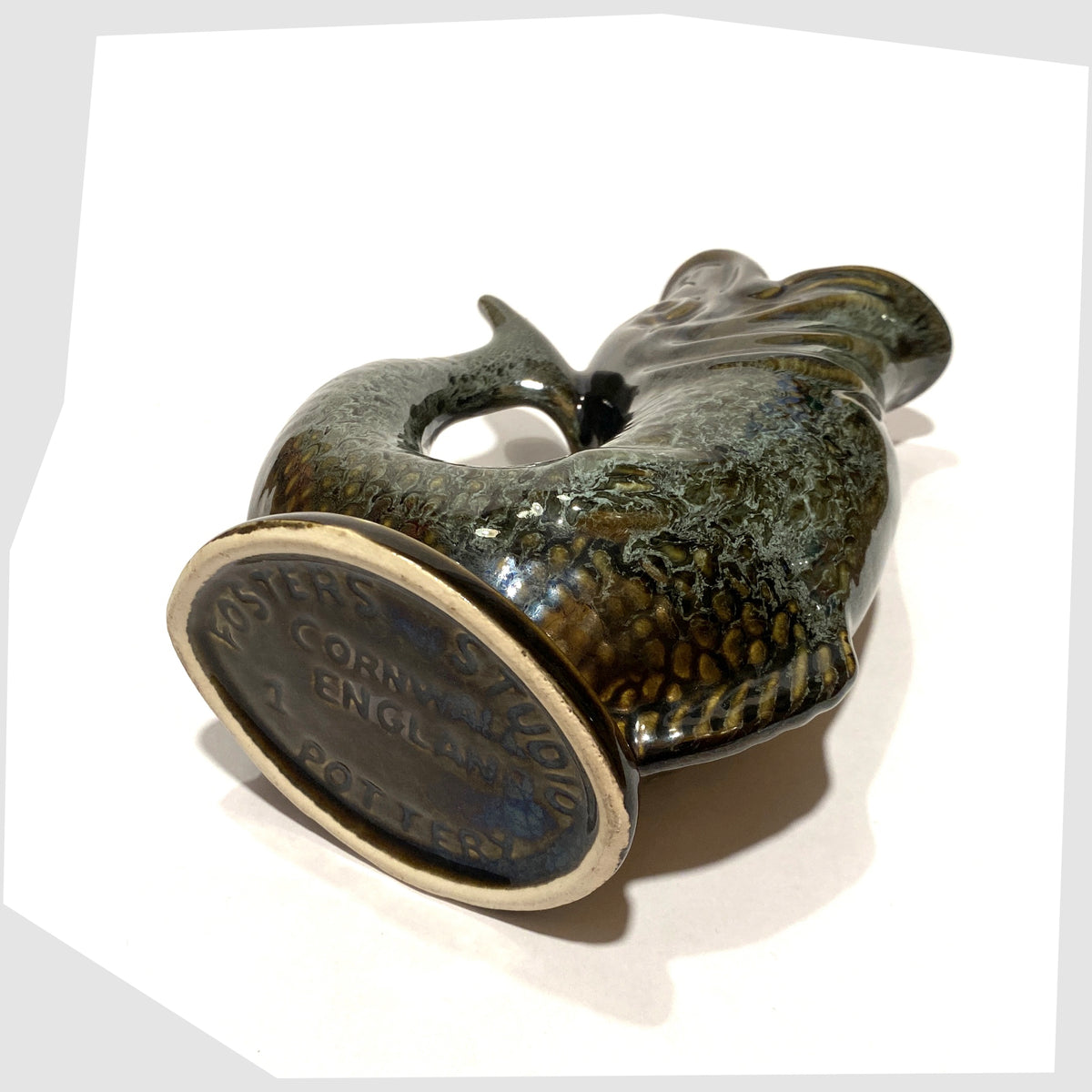 Base of the Fosters Studio Pottery Gluggle in Green honeycomb drip glaze, shown on a white background