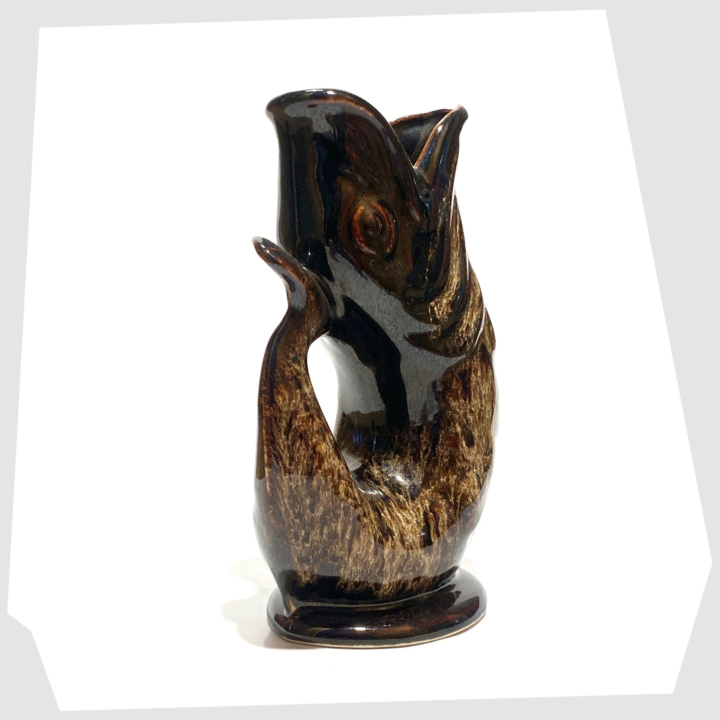 tail of the vintage fosters studio pottery gluggle jug in chestnut brown drip glaze