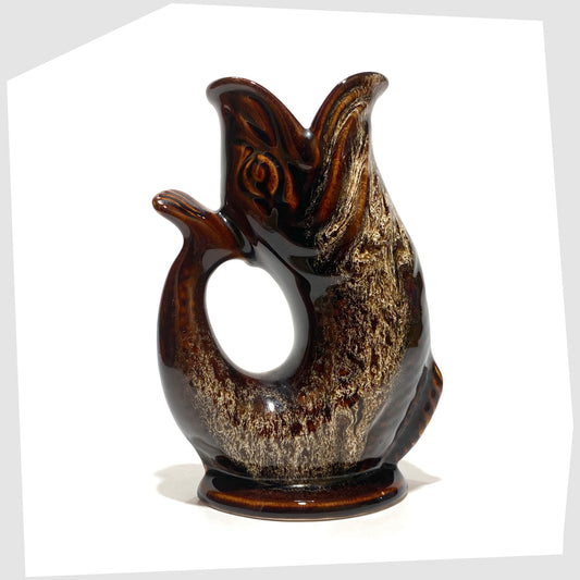 Fosters Studio Pottery Gluggle Jug in a chestnut brown with amber drip glaze, shown on a white background