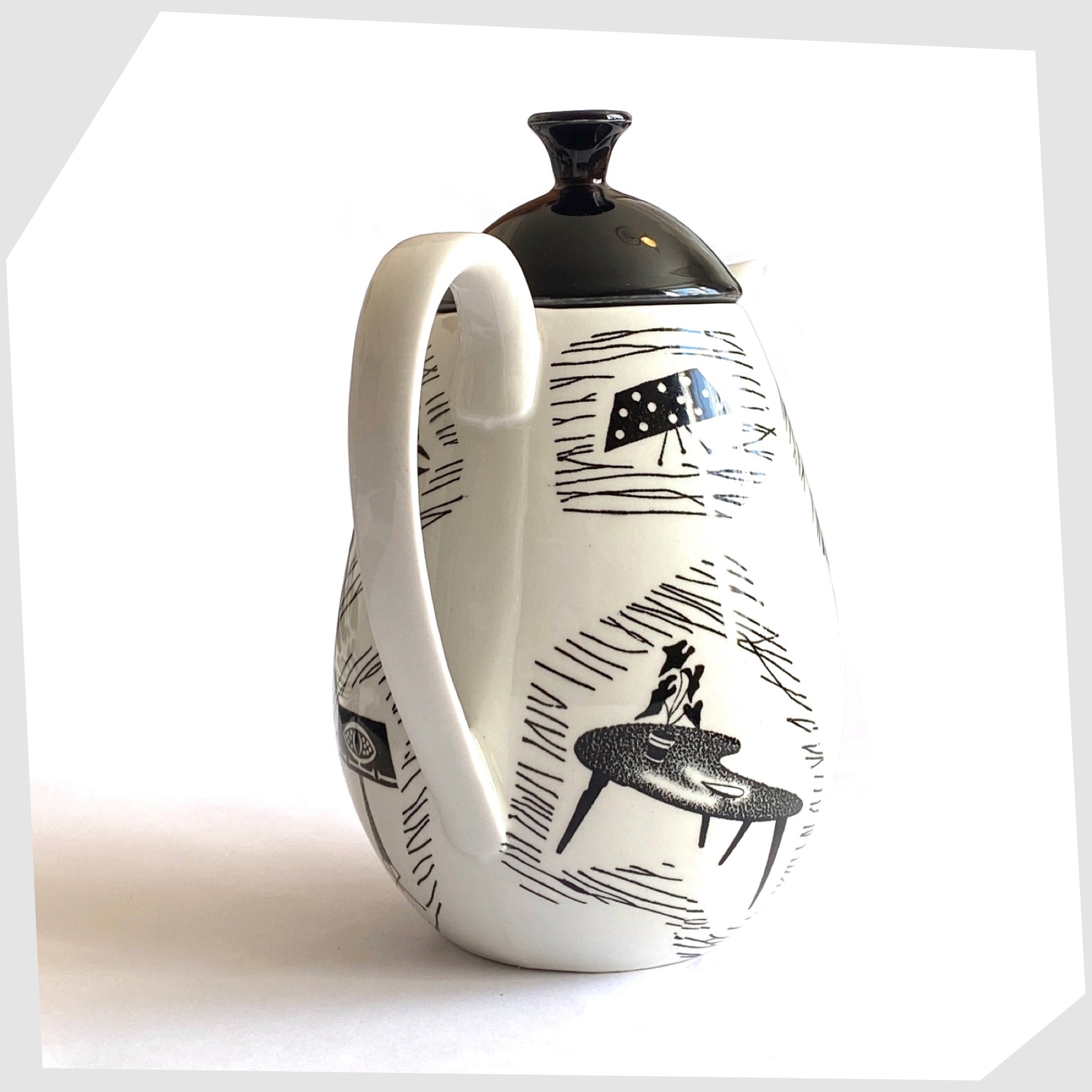 handle of the Homemaker Coffee Pot made by Ridway Potteries, Staffordshire. Monochrome Coffee Pot glazed with iconic images of mid-century homeware
