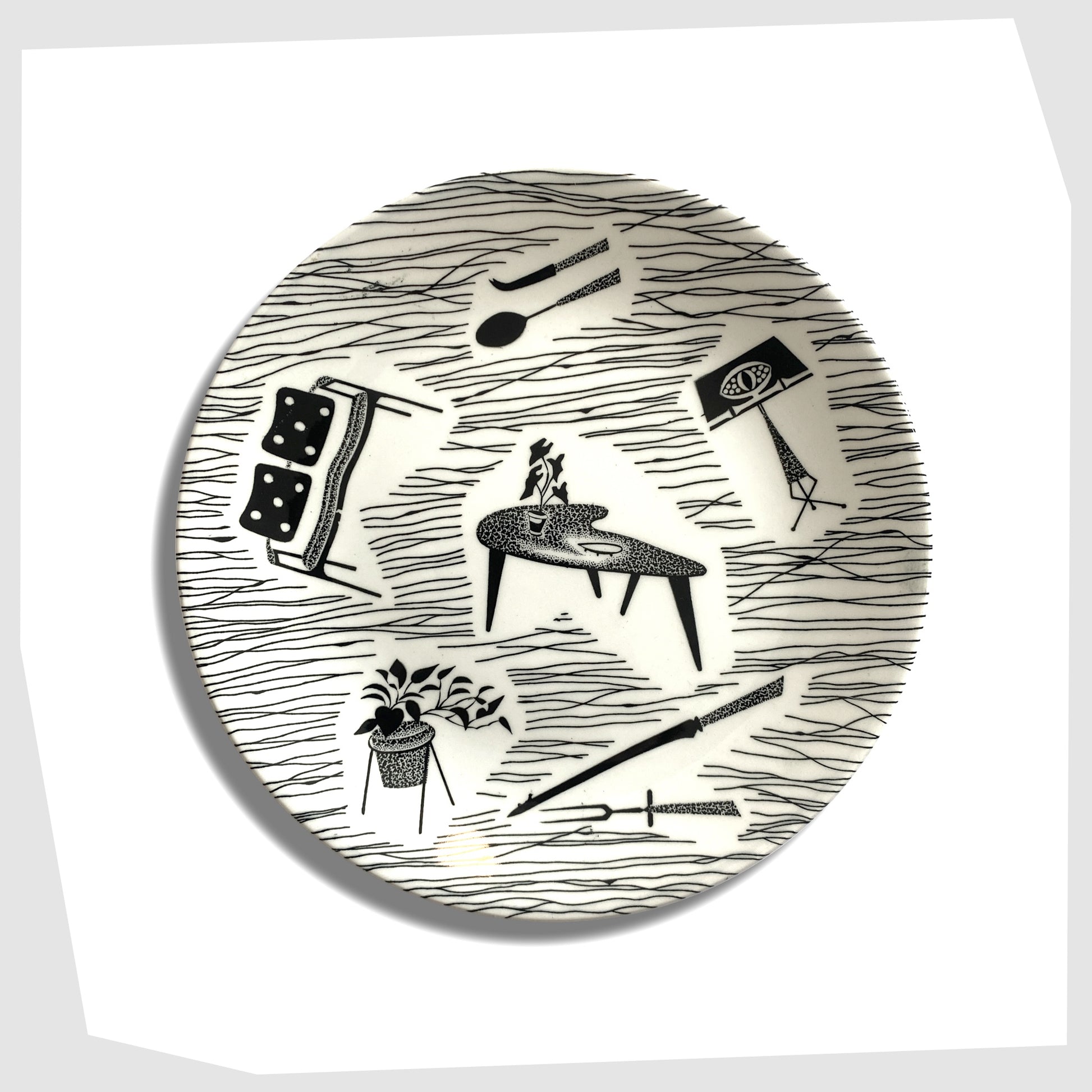 ridway pottery homemaker side plate with iconic black and white print of chairs, tables, lamps etc
