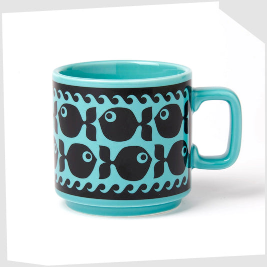 magpie x hornsea pottery fish mug, blue stoneware mug with a black repeating pattern of a fish with waves