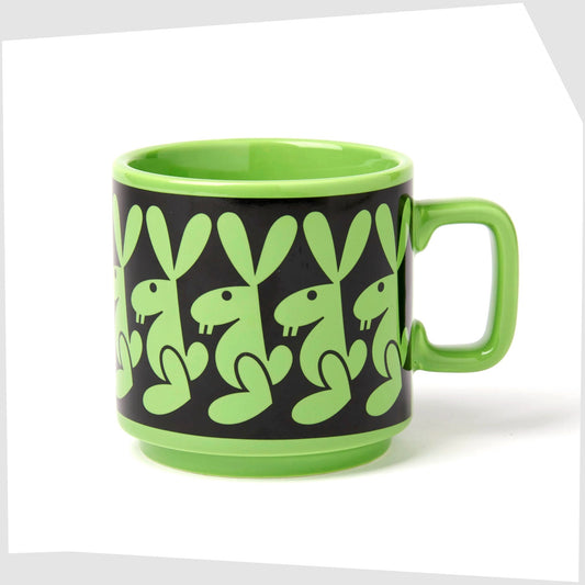magpie x hornsea pottery rabbit mug. Green stoneware mug with black repeating pattern of a bunny rabbit.
